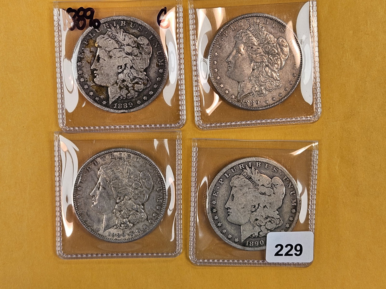 Four Morgan Silver Dollars (1 of 2)