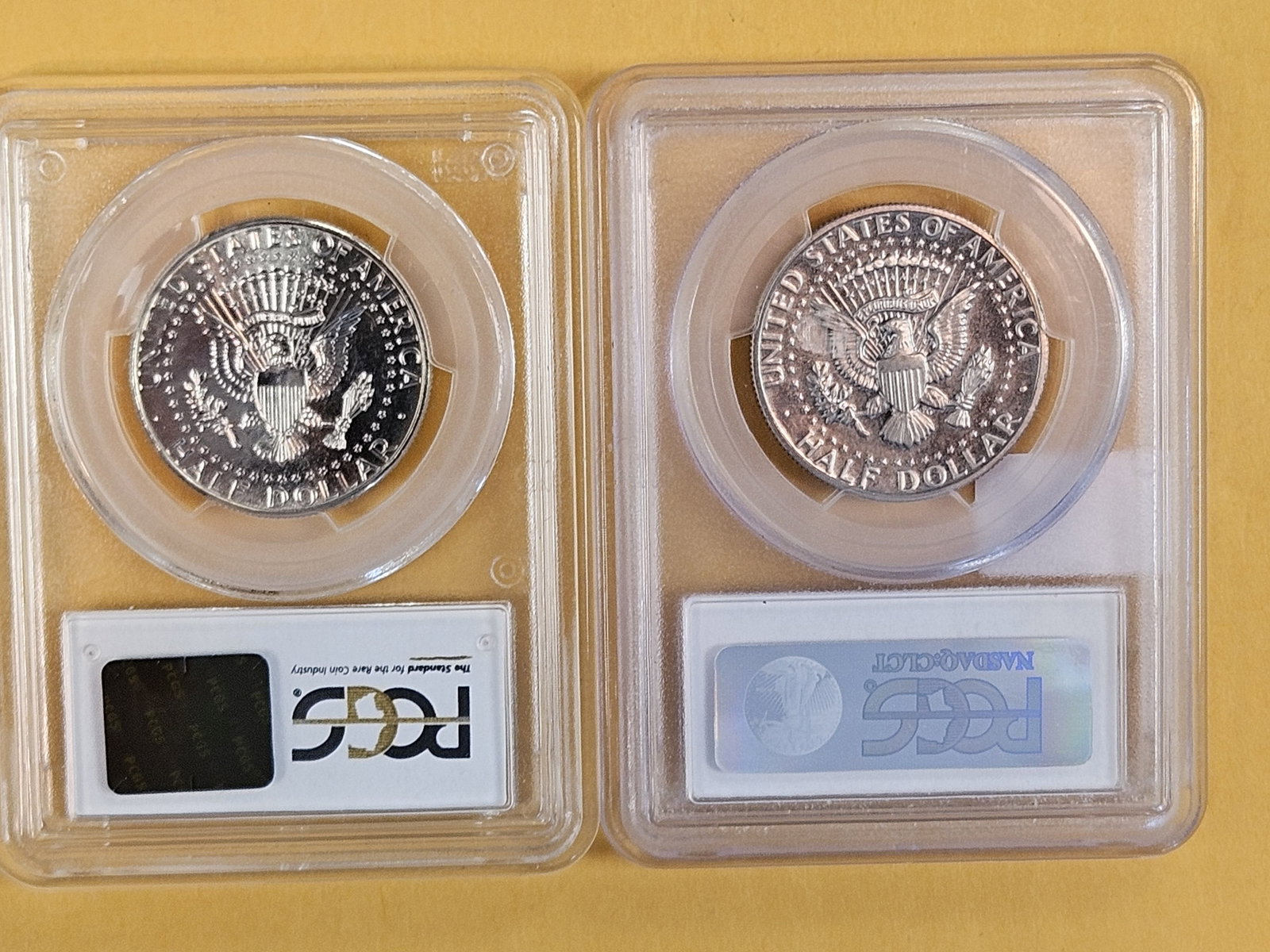 Two GEM, PGCS-graded Kennedy Half Dollars - 2
