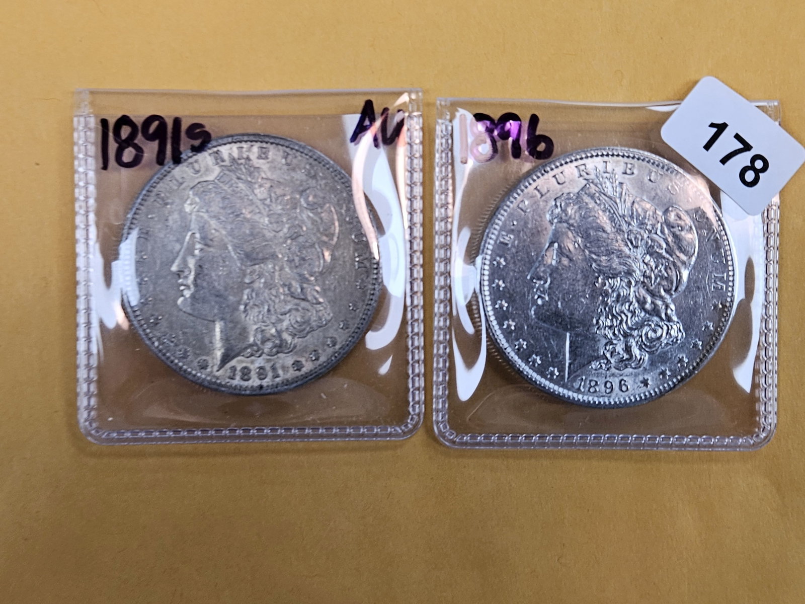 Two About Uncirculated plus Morgan Silver Dollars (1 of 3)