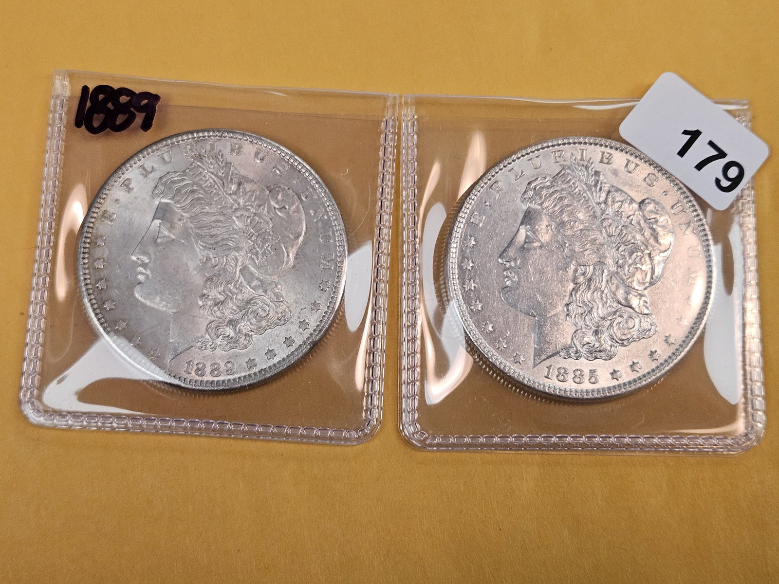 Two About Uncirculated plus Morgan Silver Dollars - 2