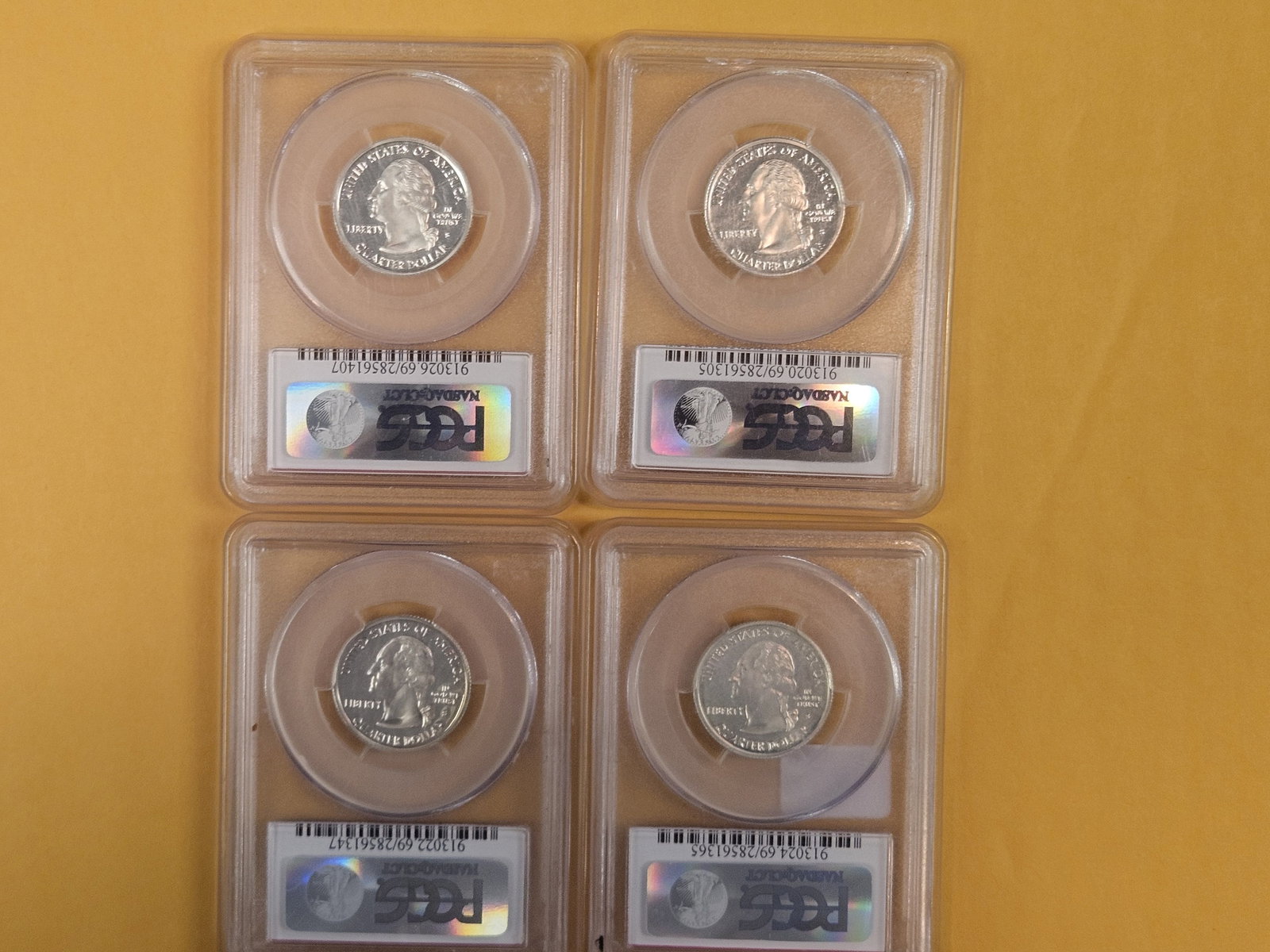 Four, PCGS-graded, SILVER Washington Quarters in Proof 69 Deep Cameo - 2
