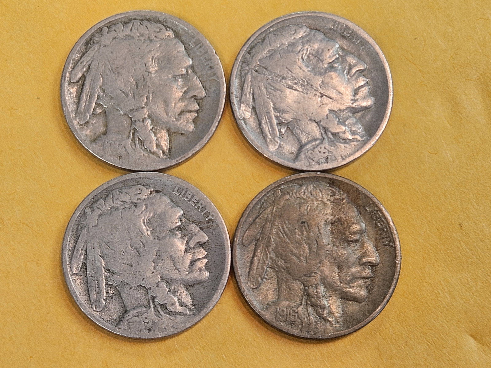 Four better date Denver-Minted Buffalo Nickels: All in Good to Very Good. 1914-D, 16-D, 18-D and 19-D