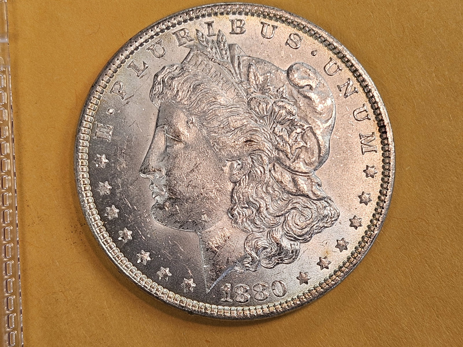 Choice Brilliant Uncirculated plus 1880 Morgan Silver Dollar: Little frosty