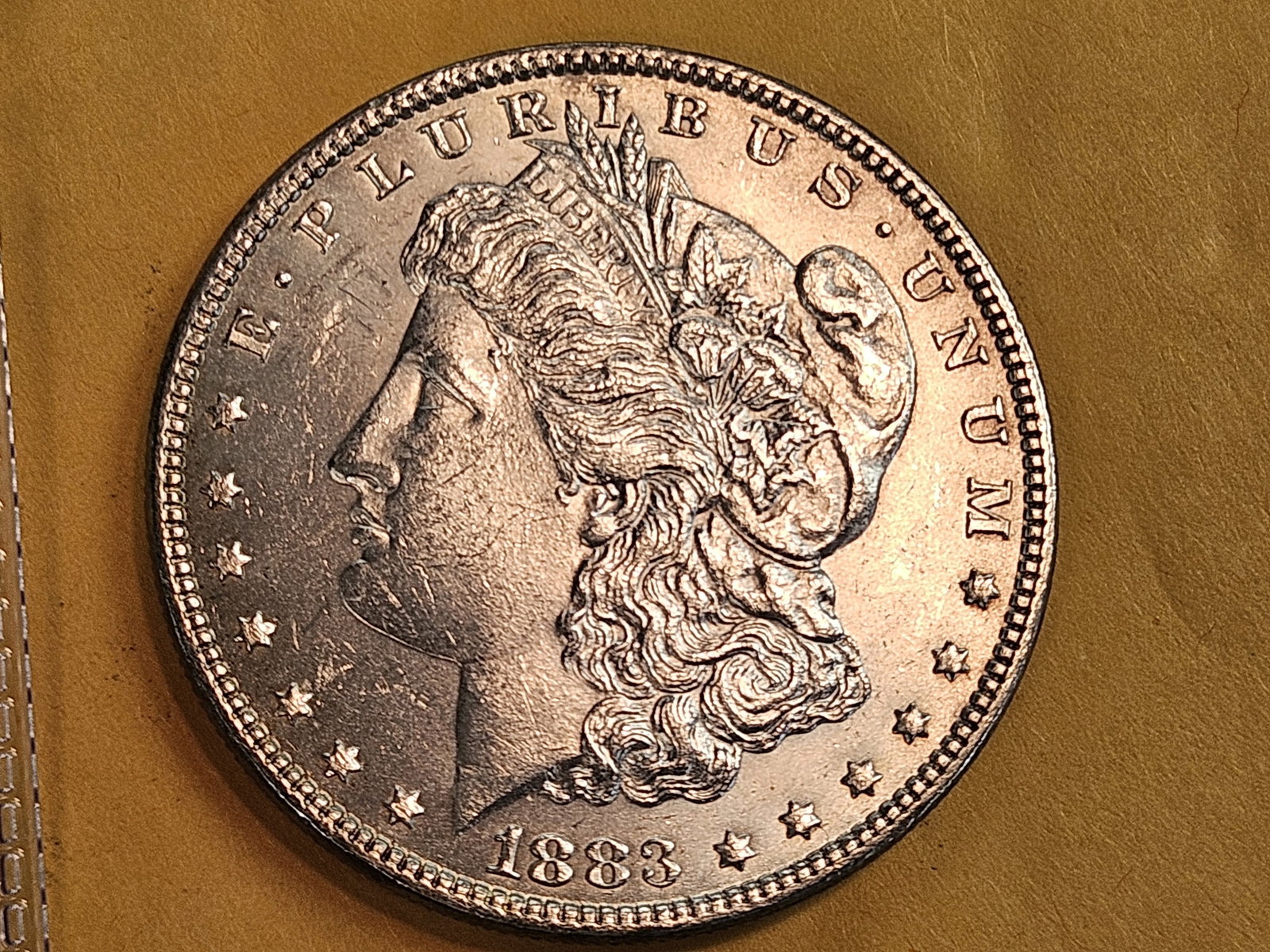 Very Choice Brilliant Uncirculated 1883 Morgan Silver Dollar: Light patina