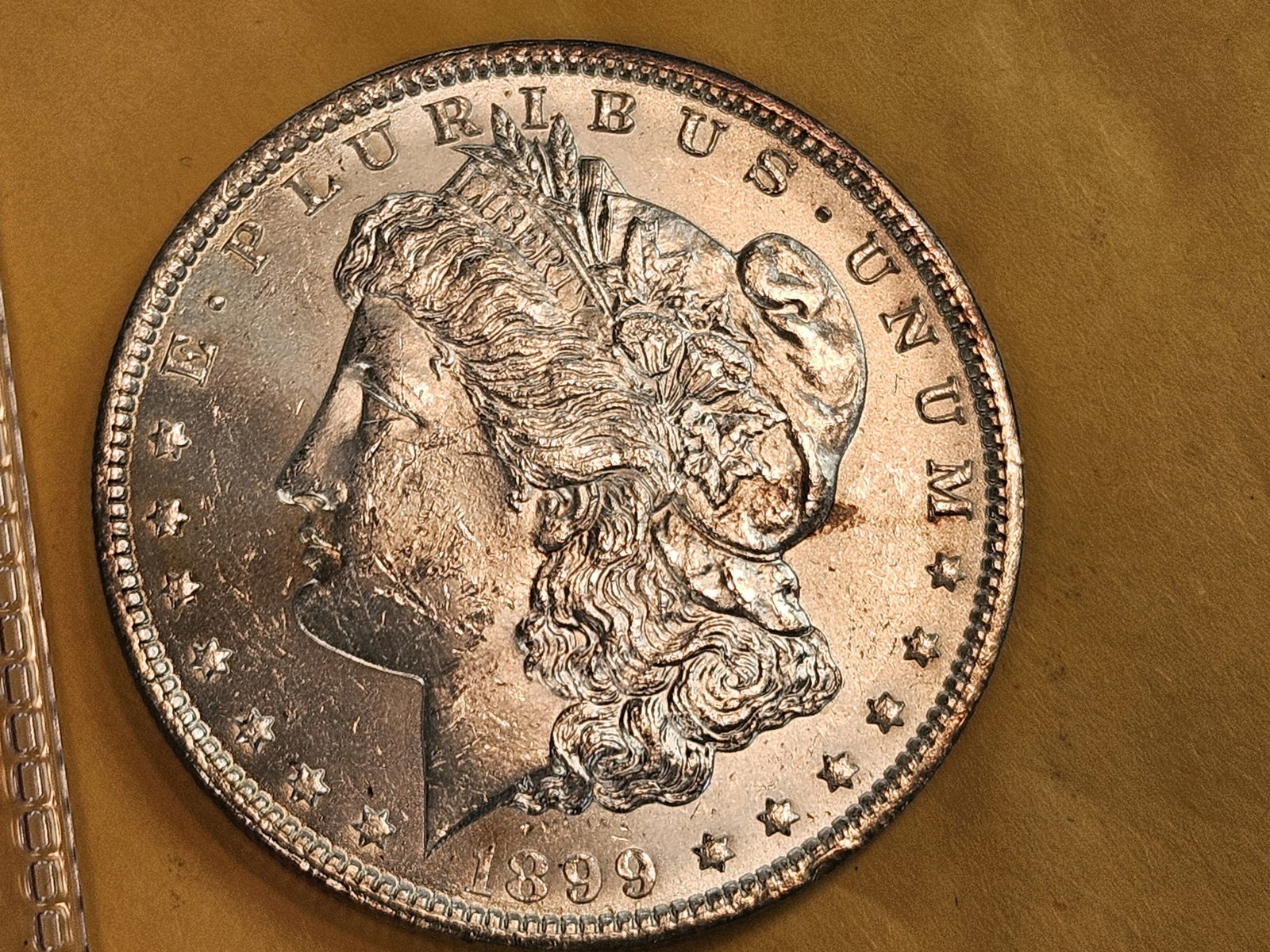Very Choice Brilliant Uncirculated 1899-O Morgan Silver Dollar: Lightly toned