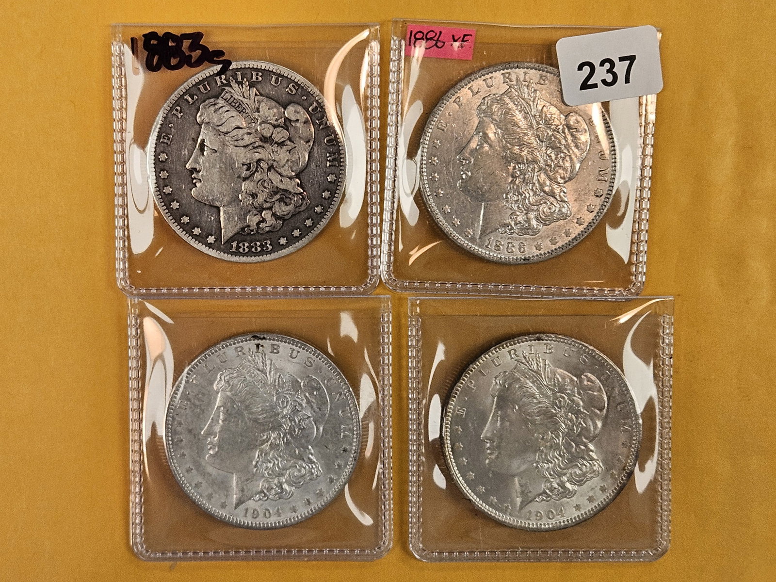 Four Morgan Silver Dollars: Mixed