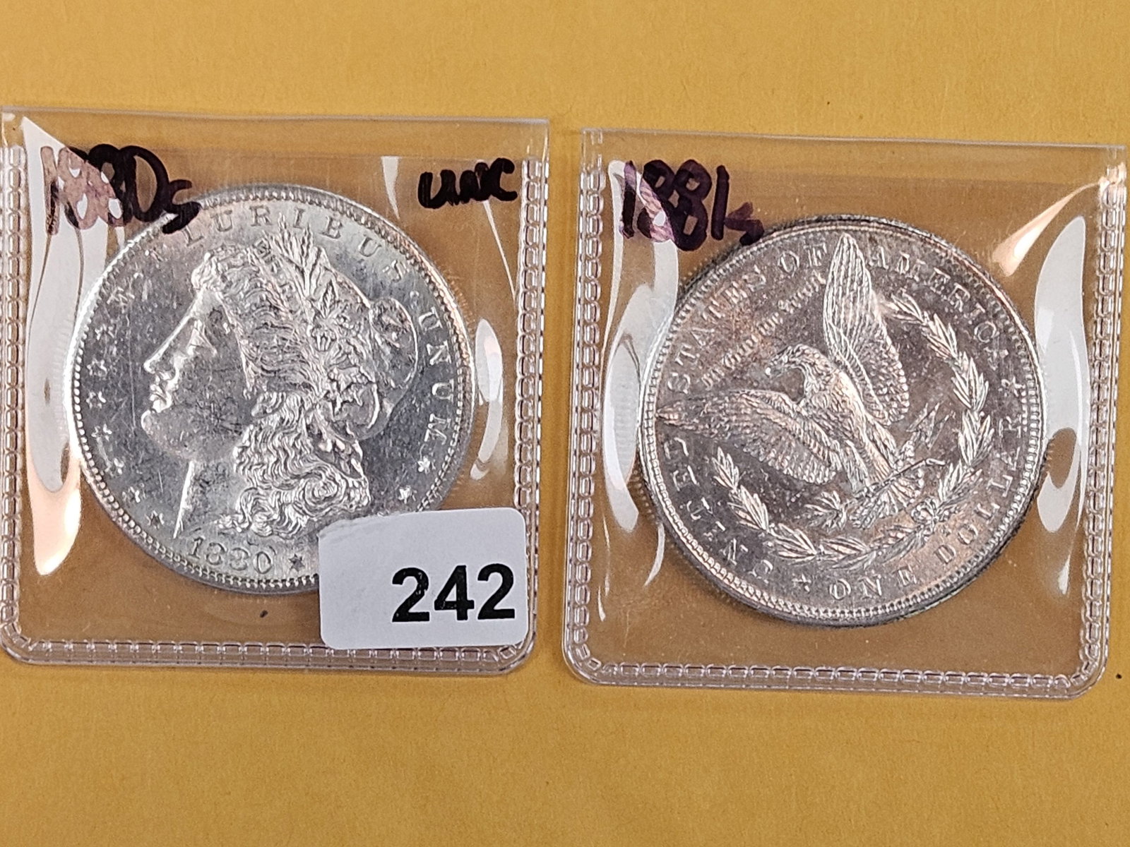 Two Brilliant Uncirculated Morgan Silver Dollars: 1880-S and 1881-S