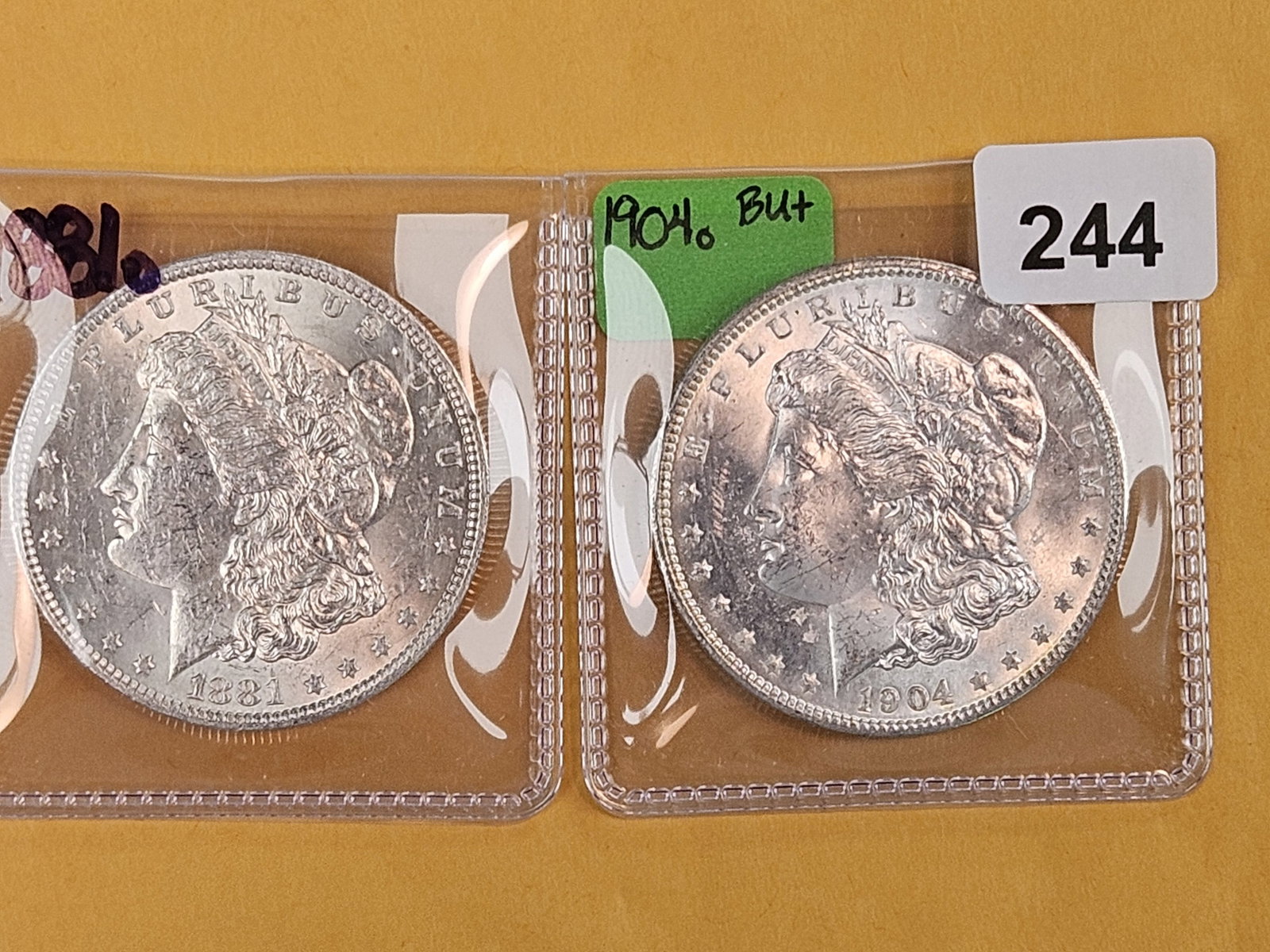 Two Brilliant Uncirculated Morgan Silver Dollars: 1881-O and 1904-O