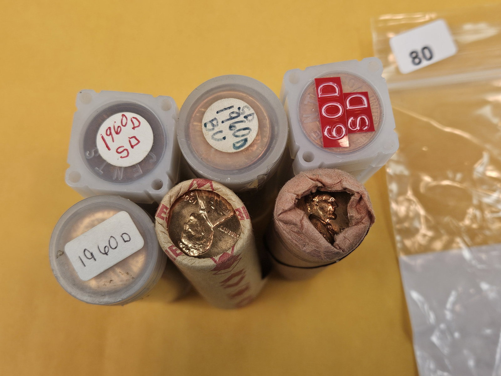 Six rolls of Brilliant Uncirculated Lincoln Cents: All 1960-D. Dealer said all small dates. Unchecked by us