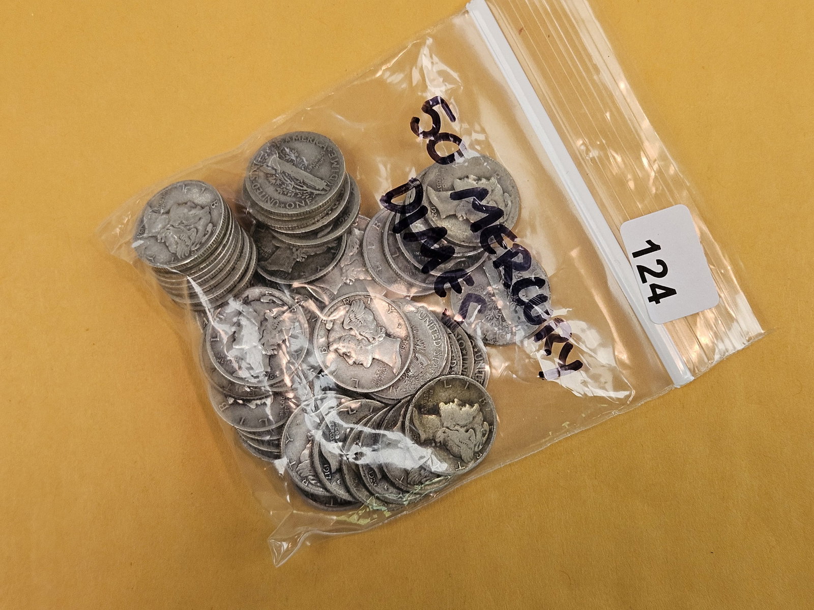 Fifty silver Mercury Dimes (1 of 2)