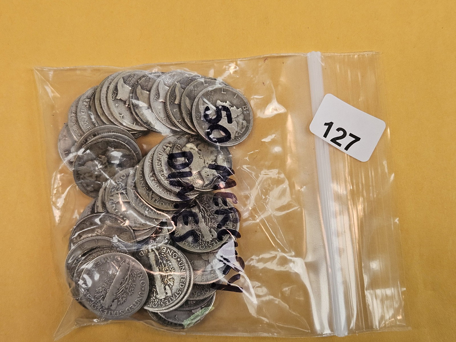 Fifty silver Mercury Dimes (1 of 2)