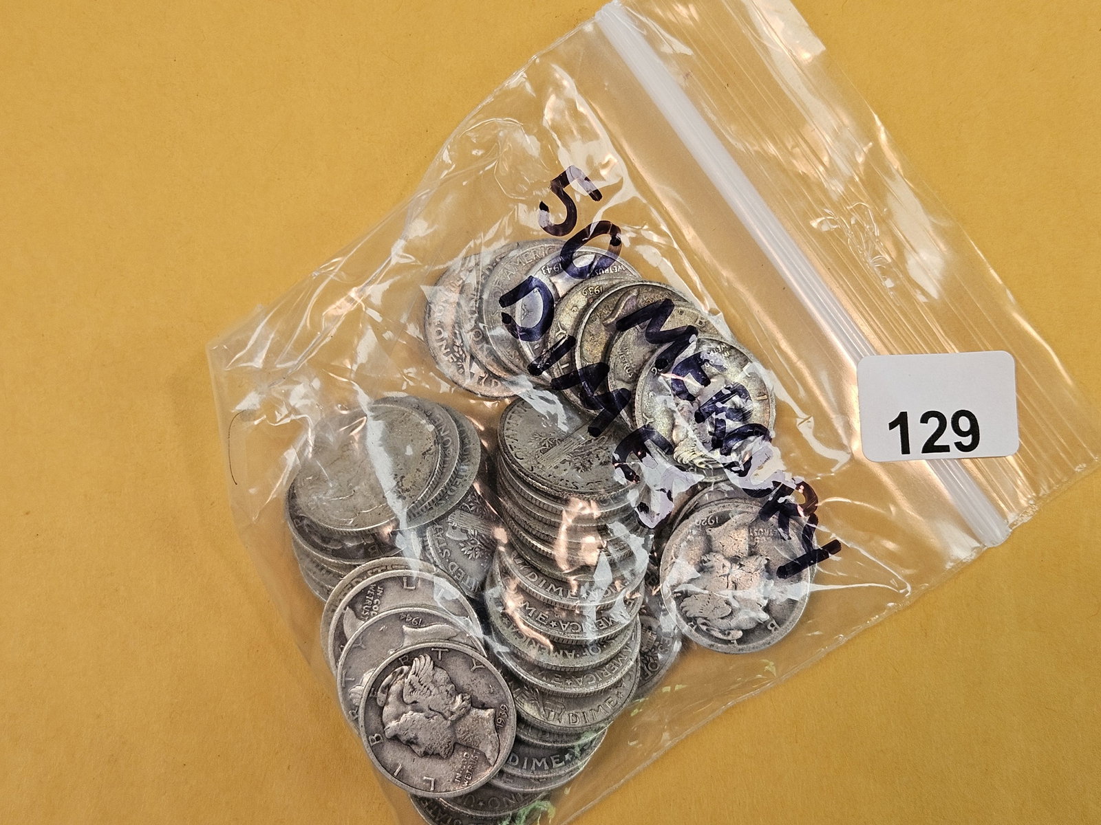 Fifty silver Mercury Dimes (1 of 2)