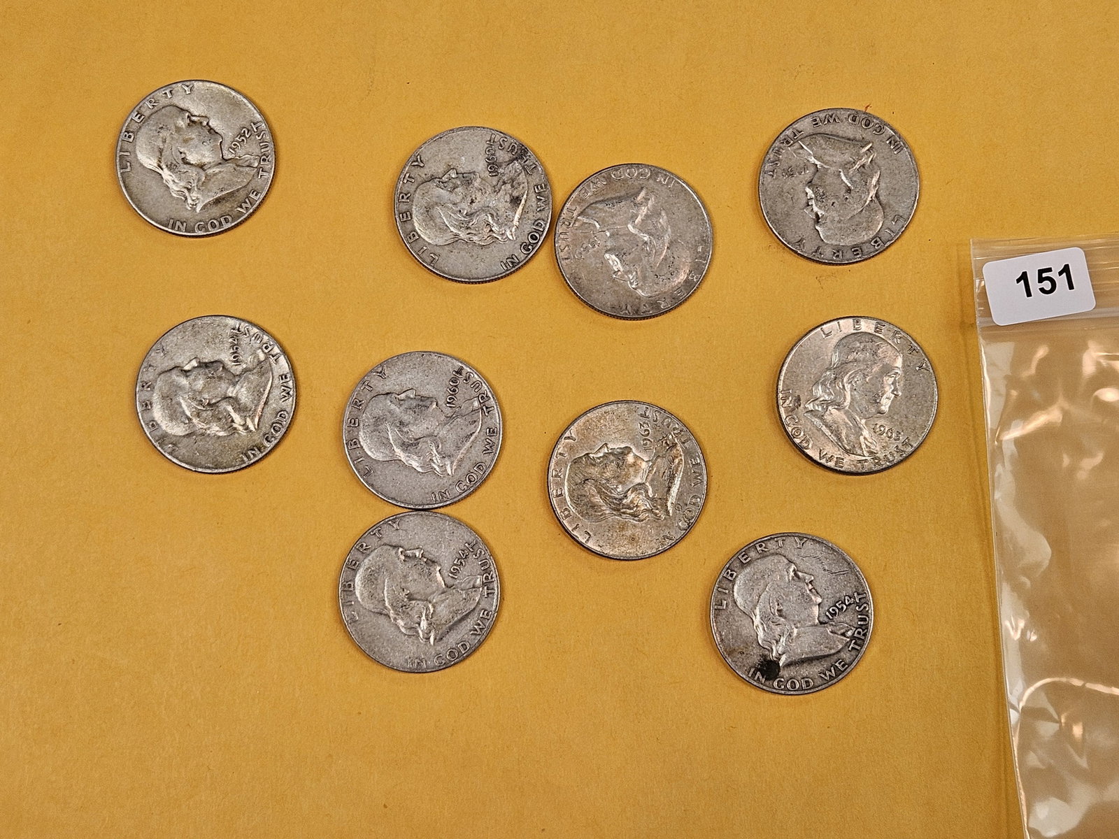 Ten mixed silver Franklin half dollars: Circulated