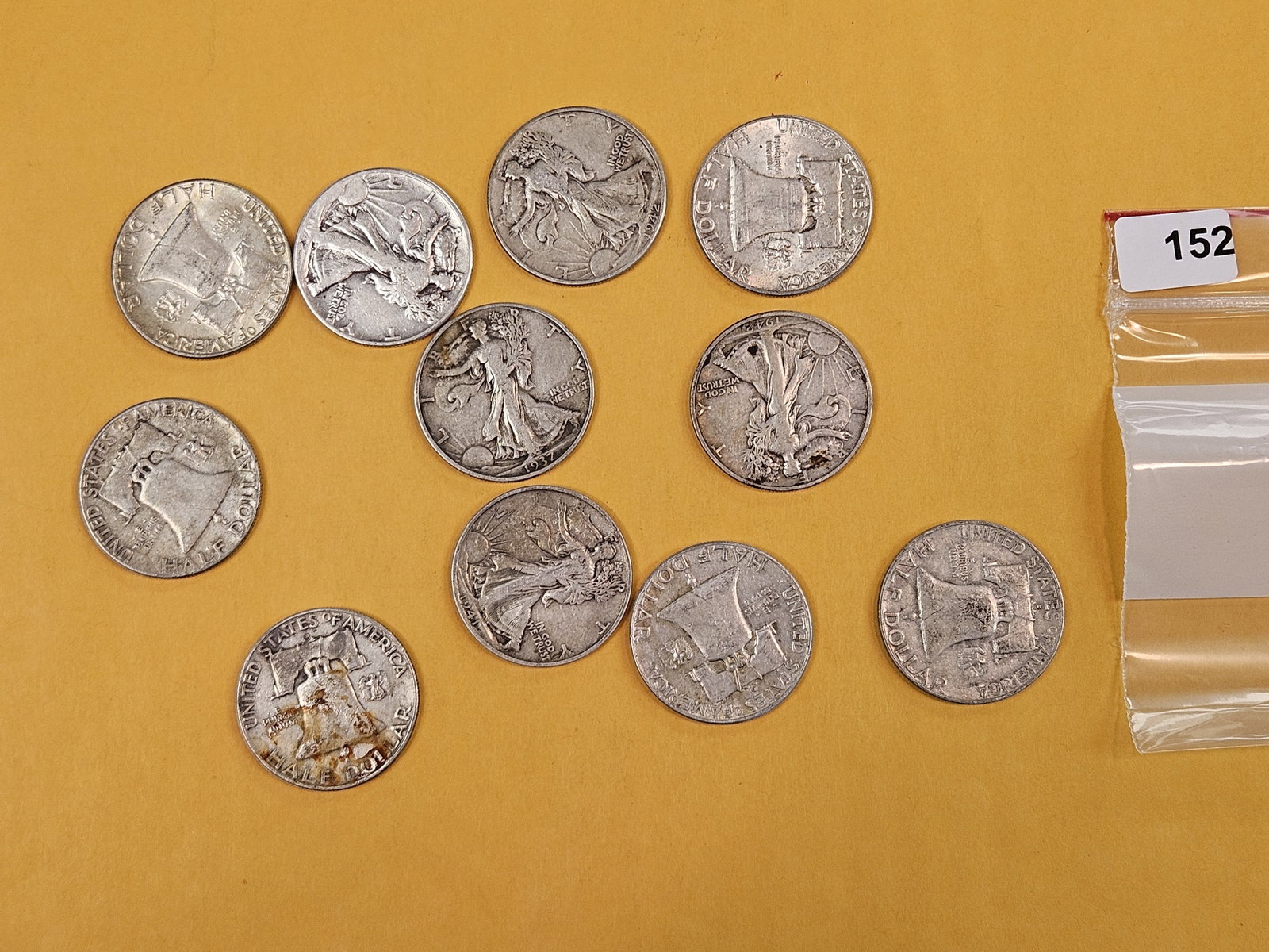 Eleven mixed silver Franklin half dollars: Circulated