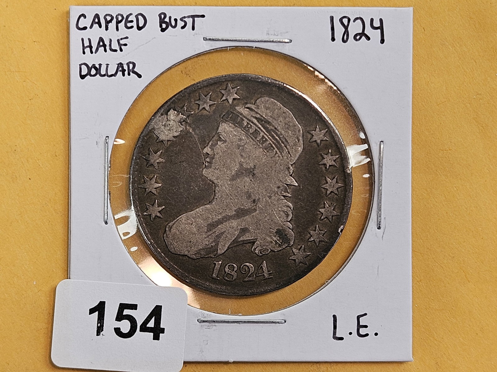1824 Capped Bust silver half dollar: Hole plugged