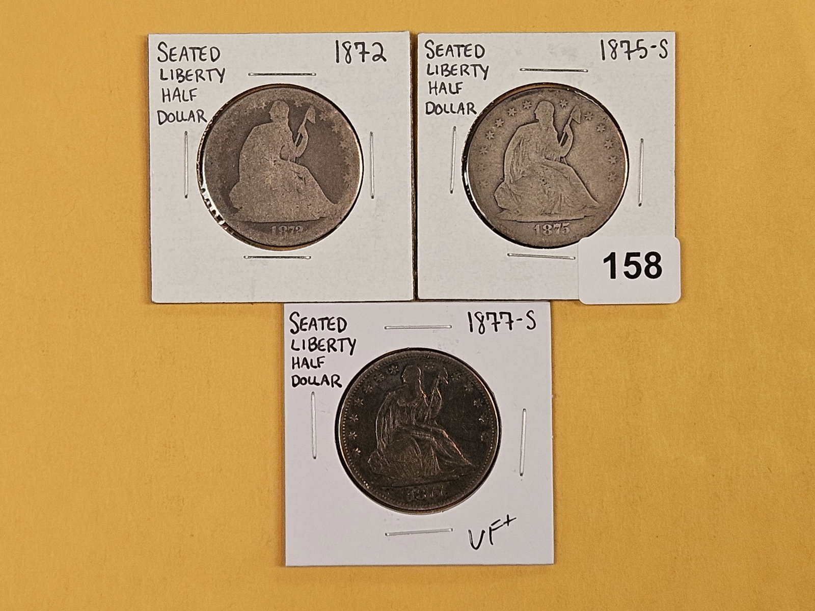 Three Seated Liberty silver half dollars: Grades from About Good to Very Fine plus