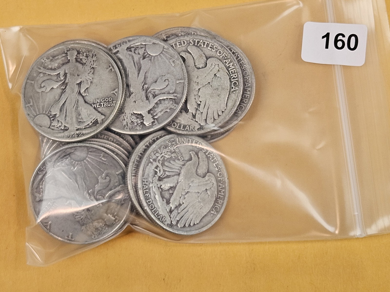 Twenty mixed silver Walking Liberty Half Dollars: Circulated