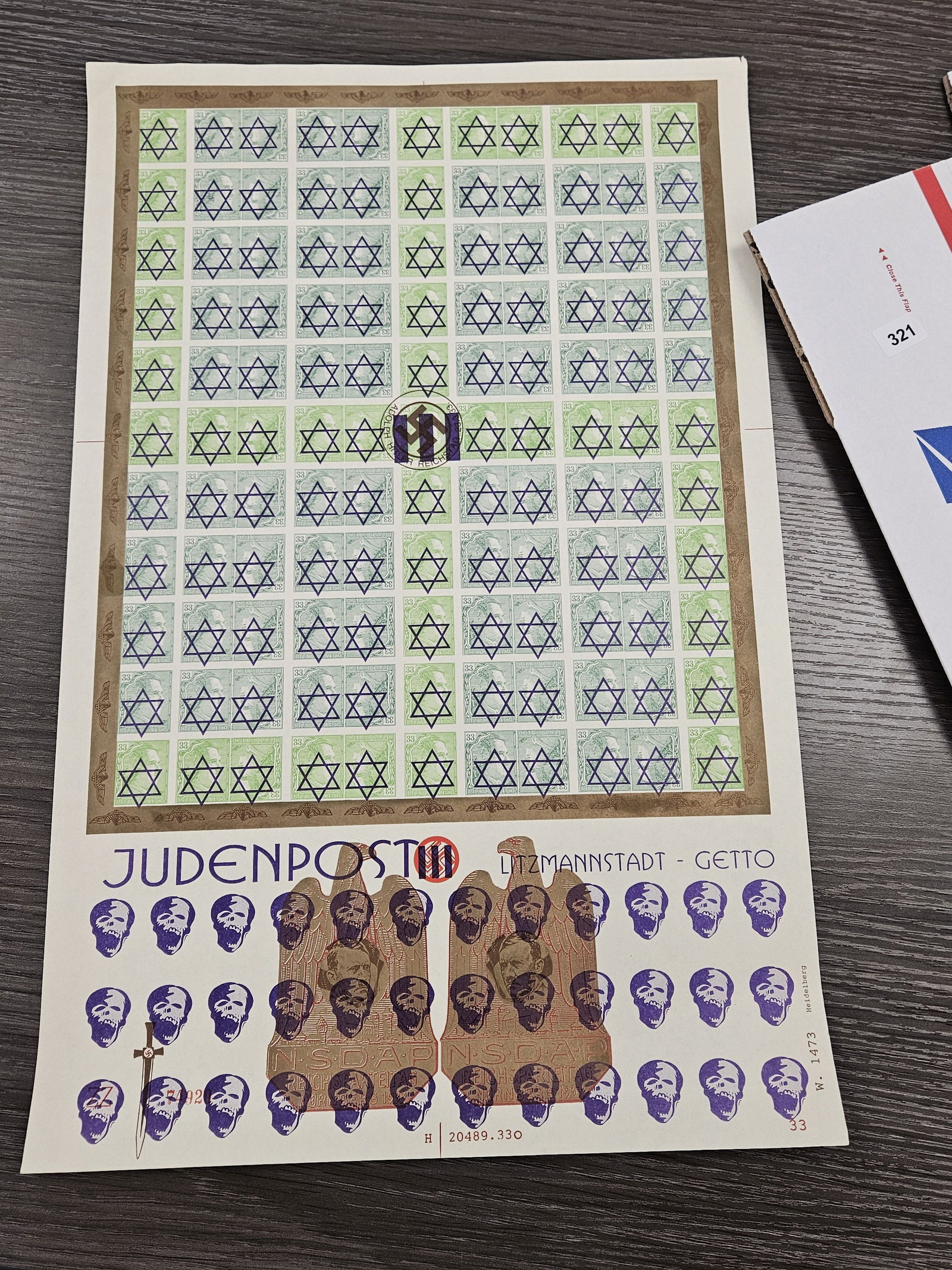 PHILATELICS!: Large Sheet of German Stamps from World War II. One hundred twenty-one stamps on the sheet. Each says "33" and has a picture of Adolph on it with a Star of David. These came from a dealer and we