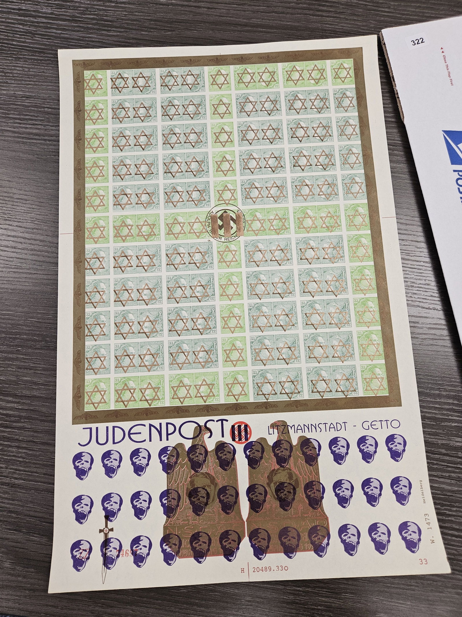 PHILATELICS!: Large Sheet of German Stamps from World War II. One hundred twenty-one stamps on the sheet. Each says "33" and has a picture of Adolph on it with a Star of David. These came from a dealer and we