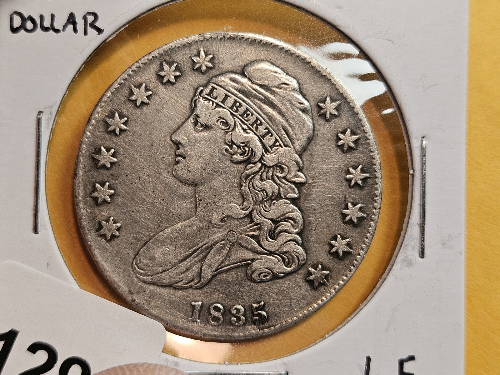 1835 Capped Bust half Dollar in Very Fine plus - details: Has an older cleaning on it