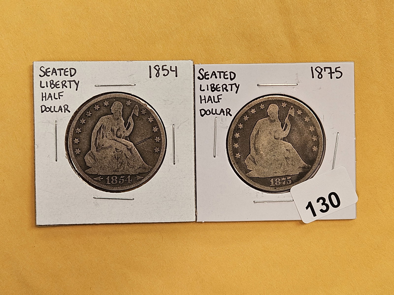 1854 with Arrows and 1875 Seated Liberty silver Half Dollars: Both in Very Good