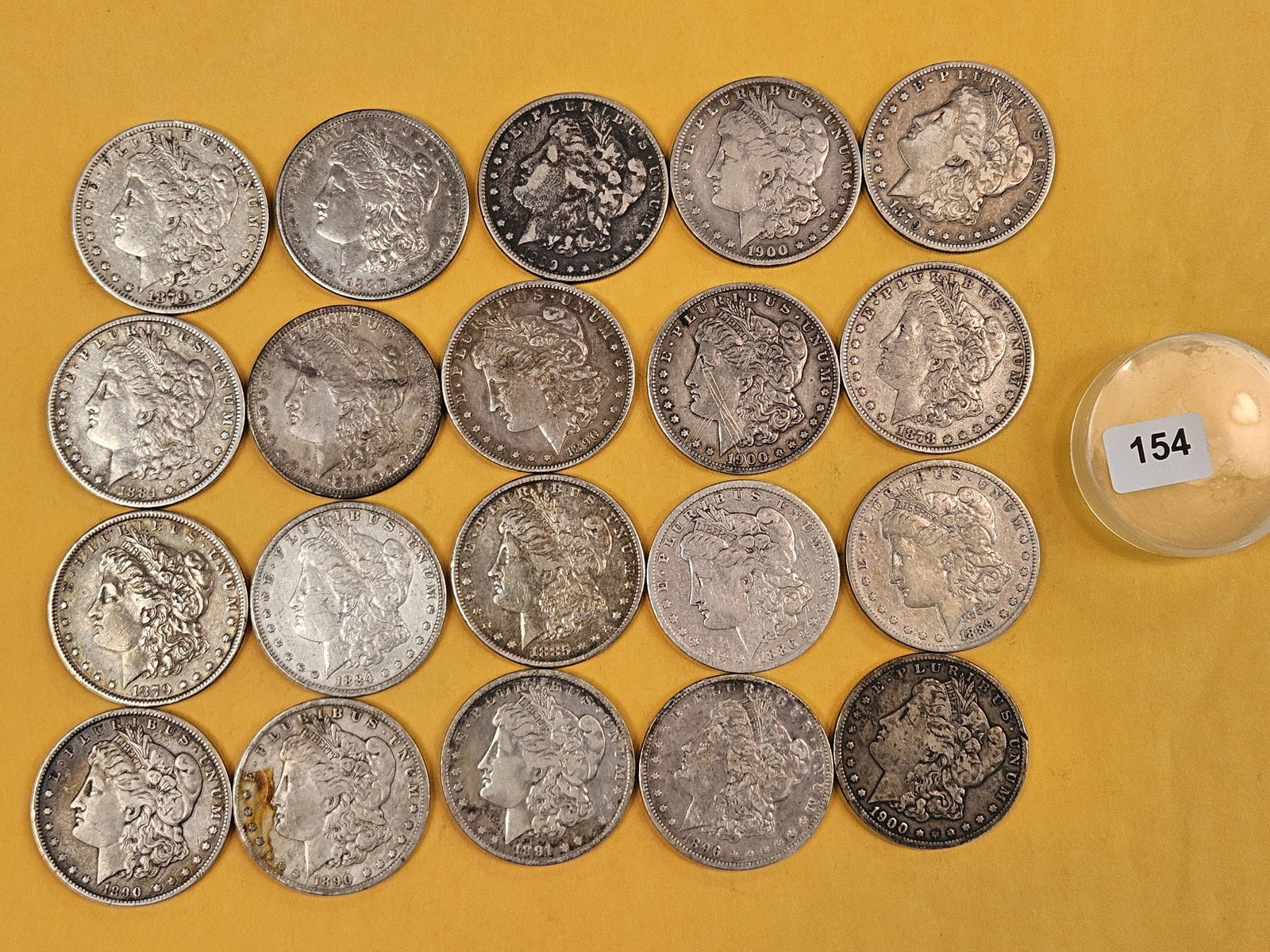 ** FULL ROLL ** Twenty Morgan Silver Dollars: All Pre-1904. Grades from Very Good through About Uncirculated - details