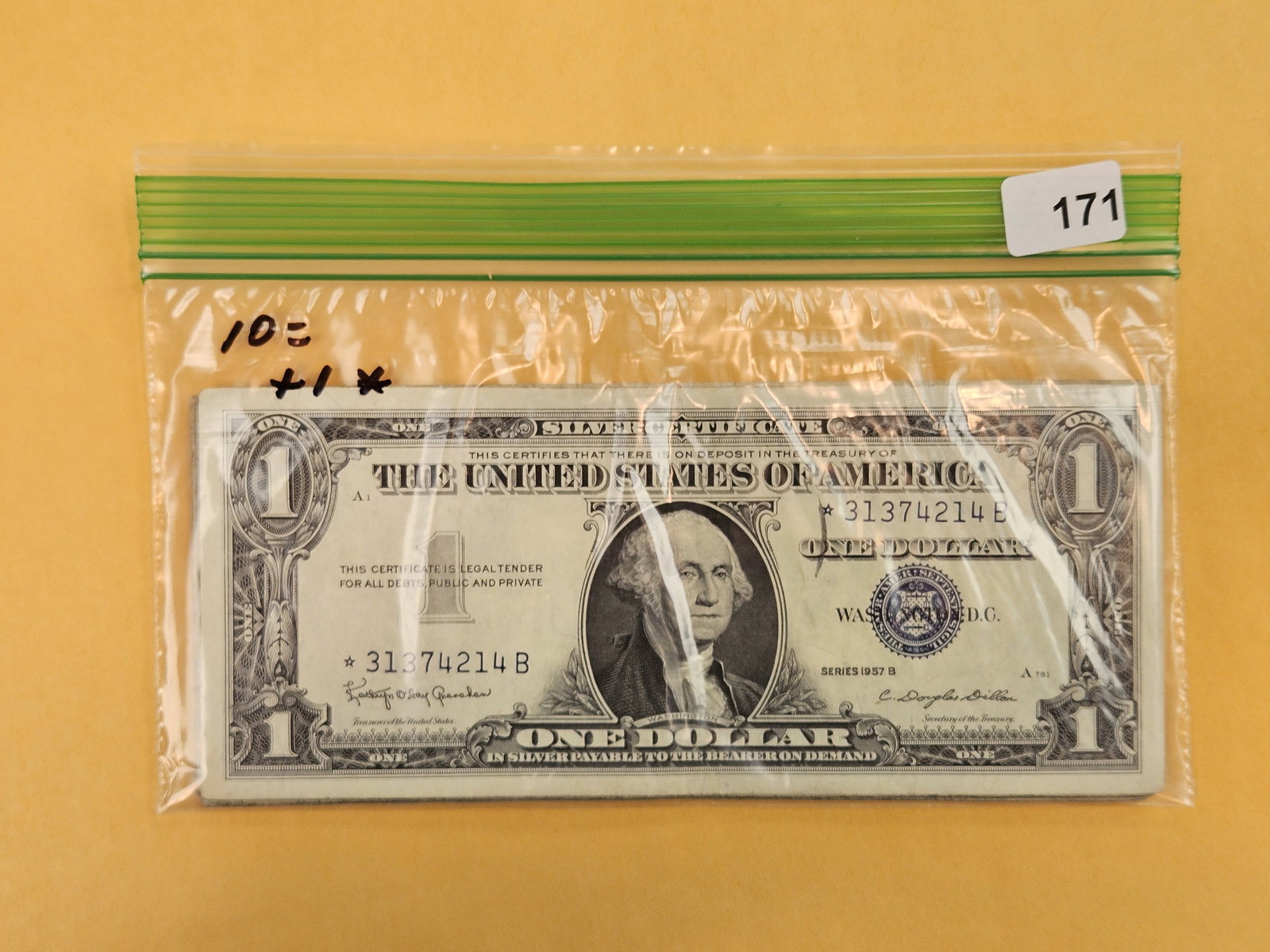 Ten, little better, One Dollar Silver Certificates: One is a star note