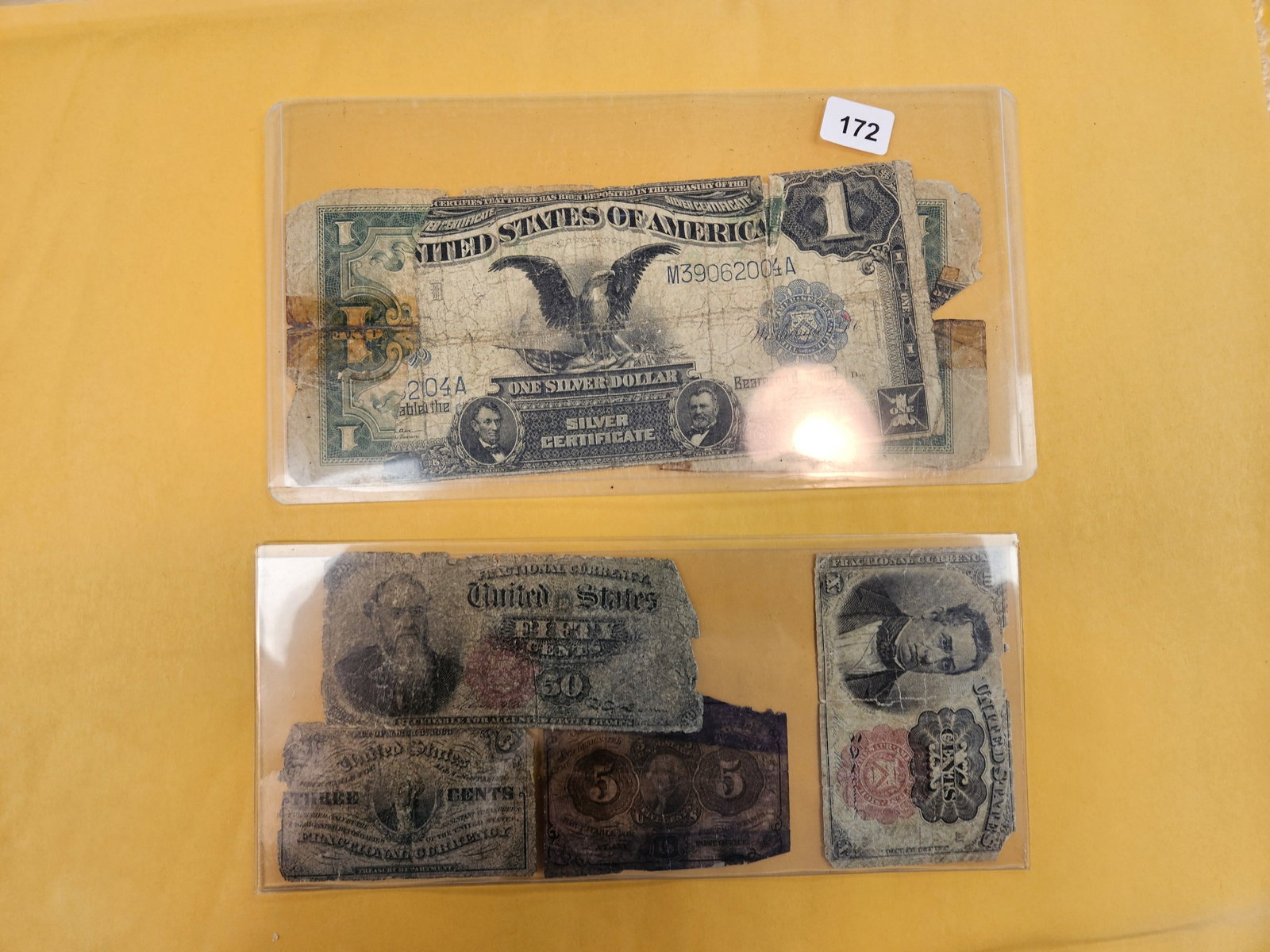 Large and Small US Currency mixer: 1899 Black Eagle, 1923 Large size and four smaller Fractional Currency pieces