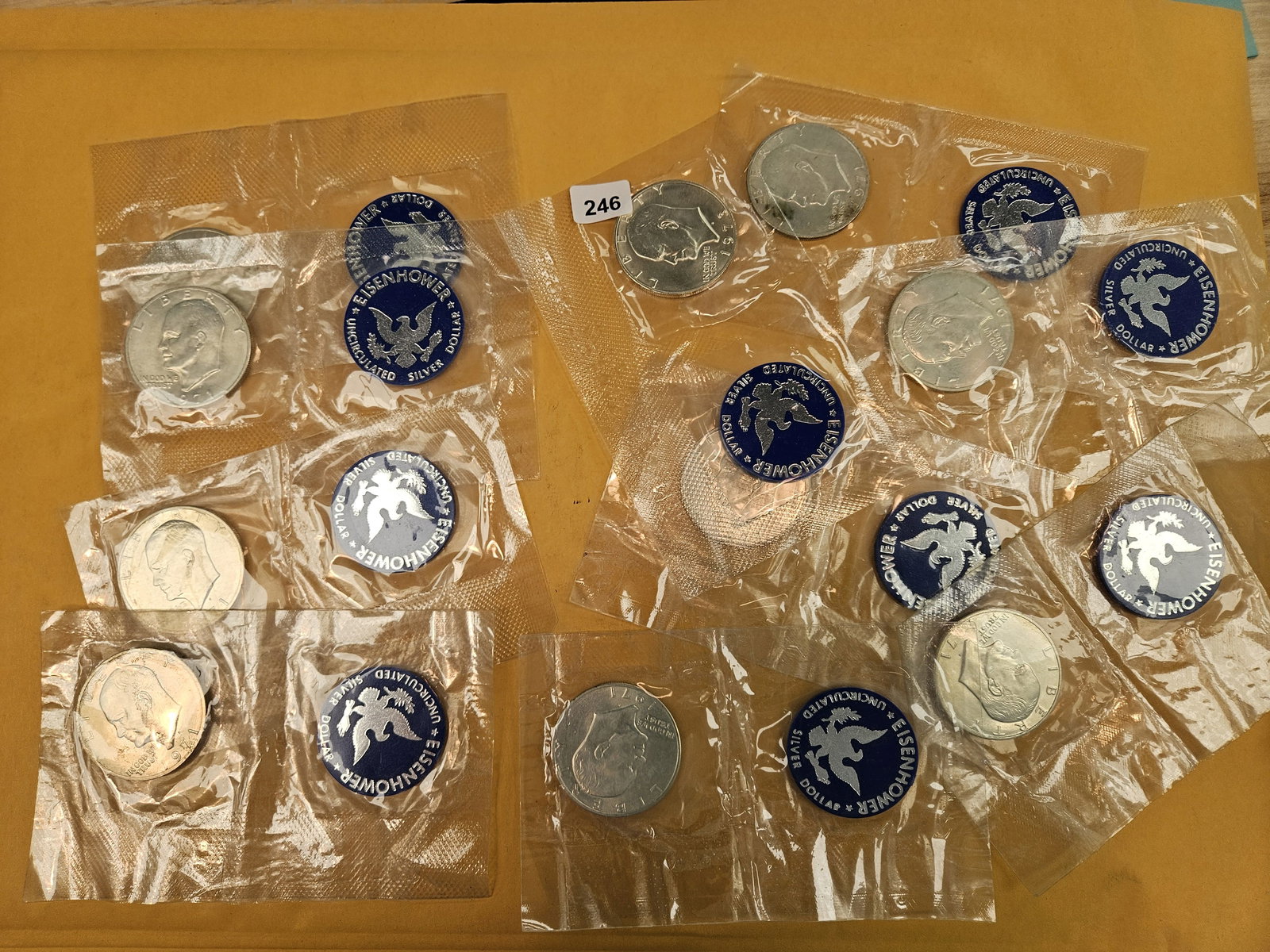 Ten GEM Brilliant Uncirculated SILVER Blue Ike Dollars: Silver Eisenhower Dollars. All in original blister packs