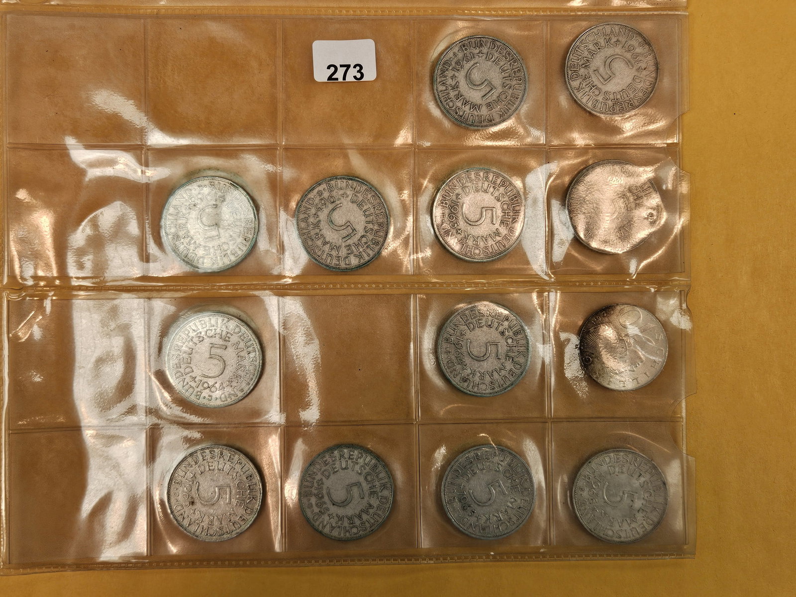 Thirteen SILVER German and Austrian coins: In a pvc plastic holder