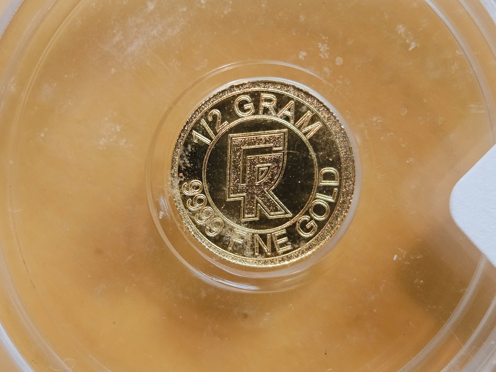 GOLD! PERFECT! ICG-graded Clean Ripz .9999 fine gold Prooflike Art round: Perfect Grade! MS-70 Prooflike. No Date. One-half Gram