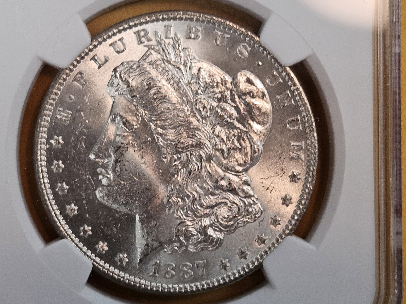 NGC 1887 Morgan Dollar in Mint State 63: Good luster