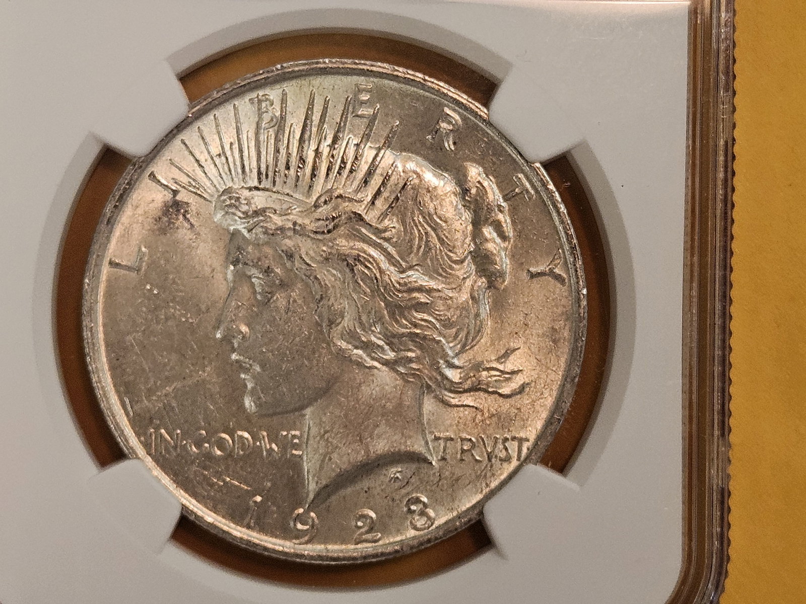 NGC 1923 Peace Silver Dollar in Mint State 61: The most okay-est Peace in 61 this auction!