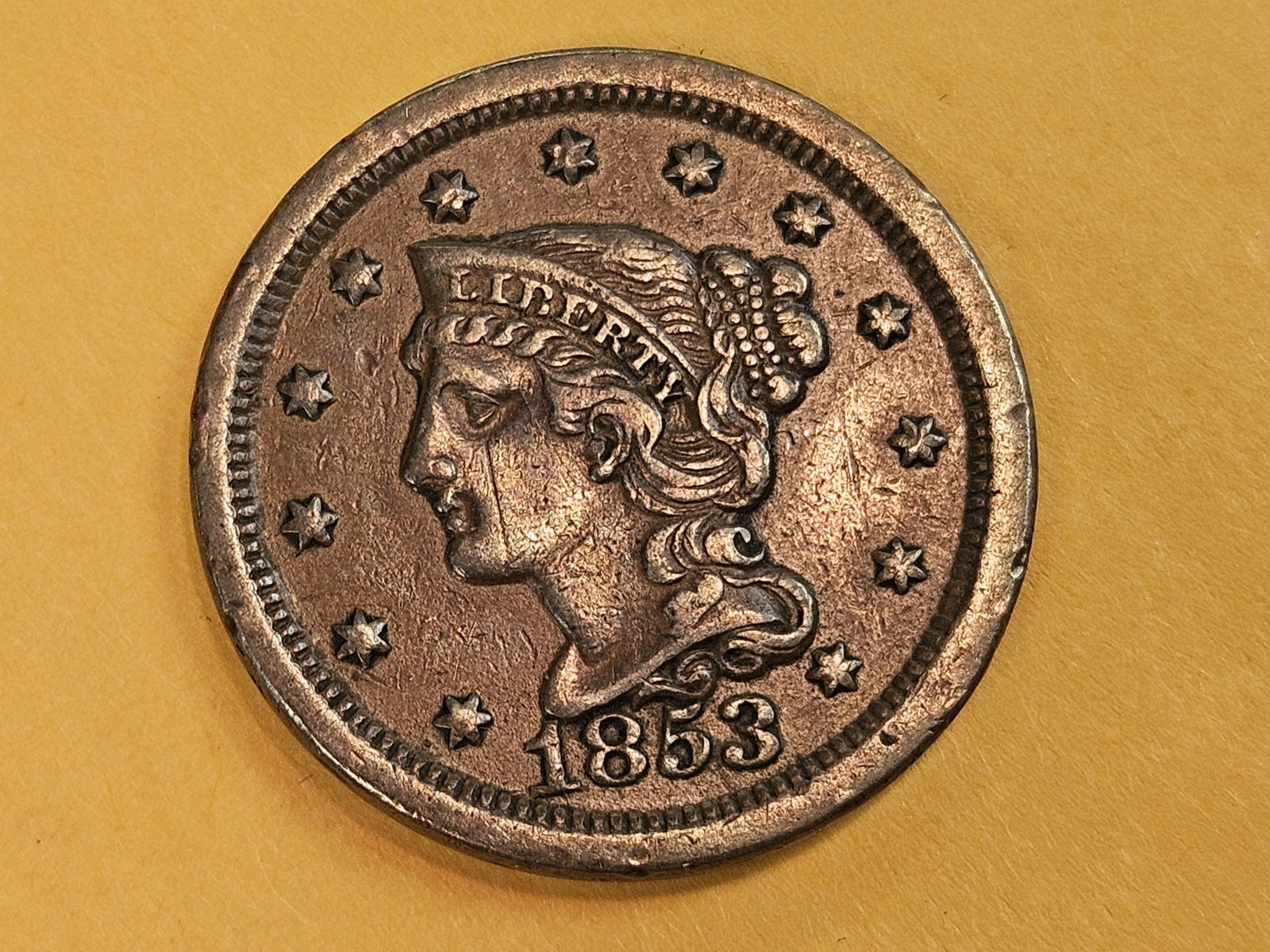 1853 Braided Hair Large cent in About Uncirculated: Light mark on the cheek