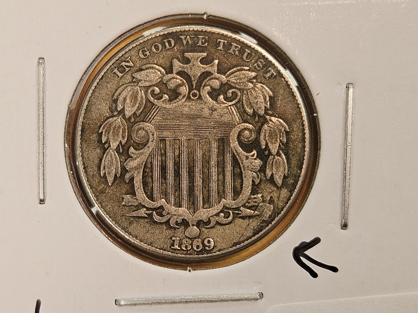 Mint Errors! 1869 Shield Nickel in Very Fine plus: Several errors. Numerous die breaks and a large planchet lamination flaw