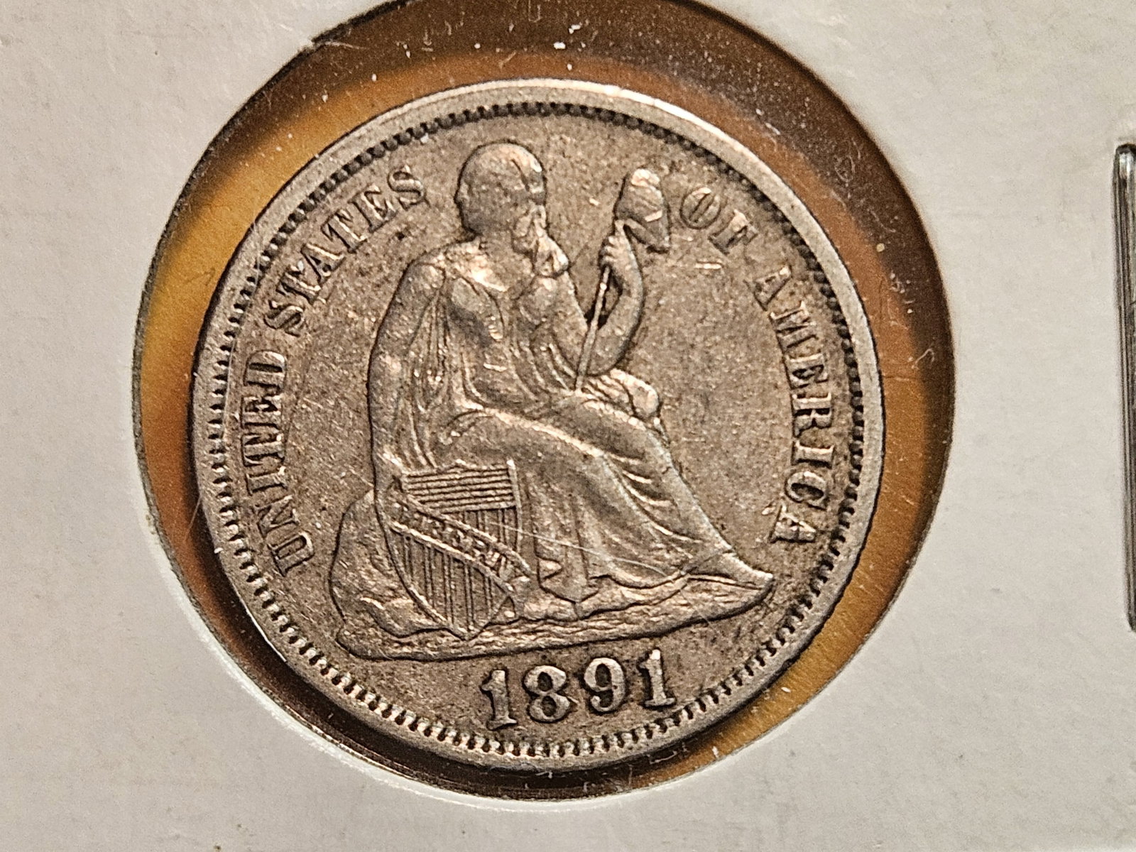 1891 Seated Liberty silver dime in About Uncirculated: Original patina