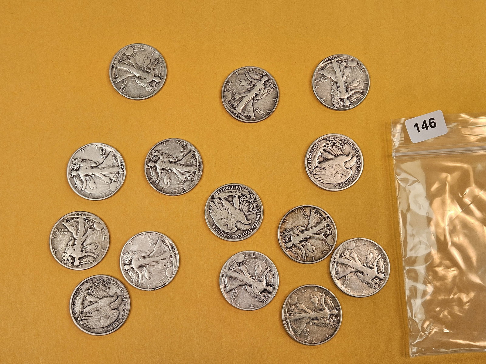 Fourteen mixed, silver, Walking Liberty half dollars: Circulated