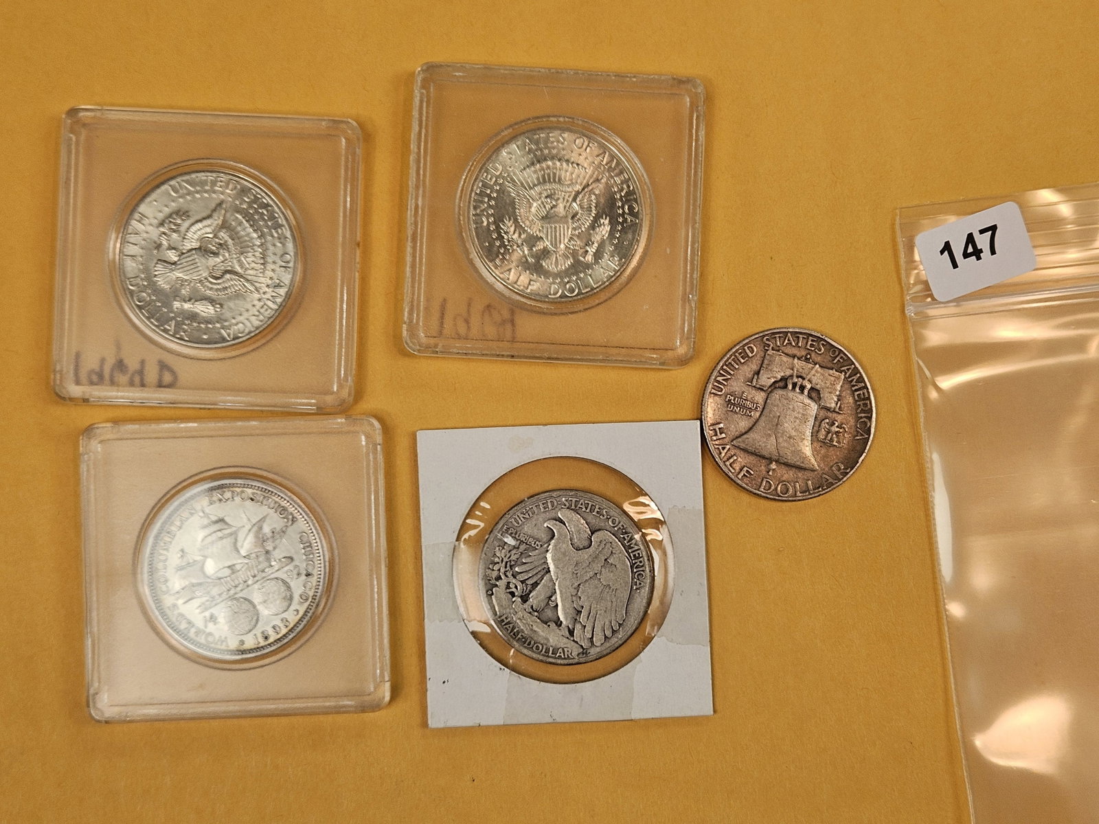 Five mixed design silver half dollars - 2