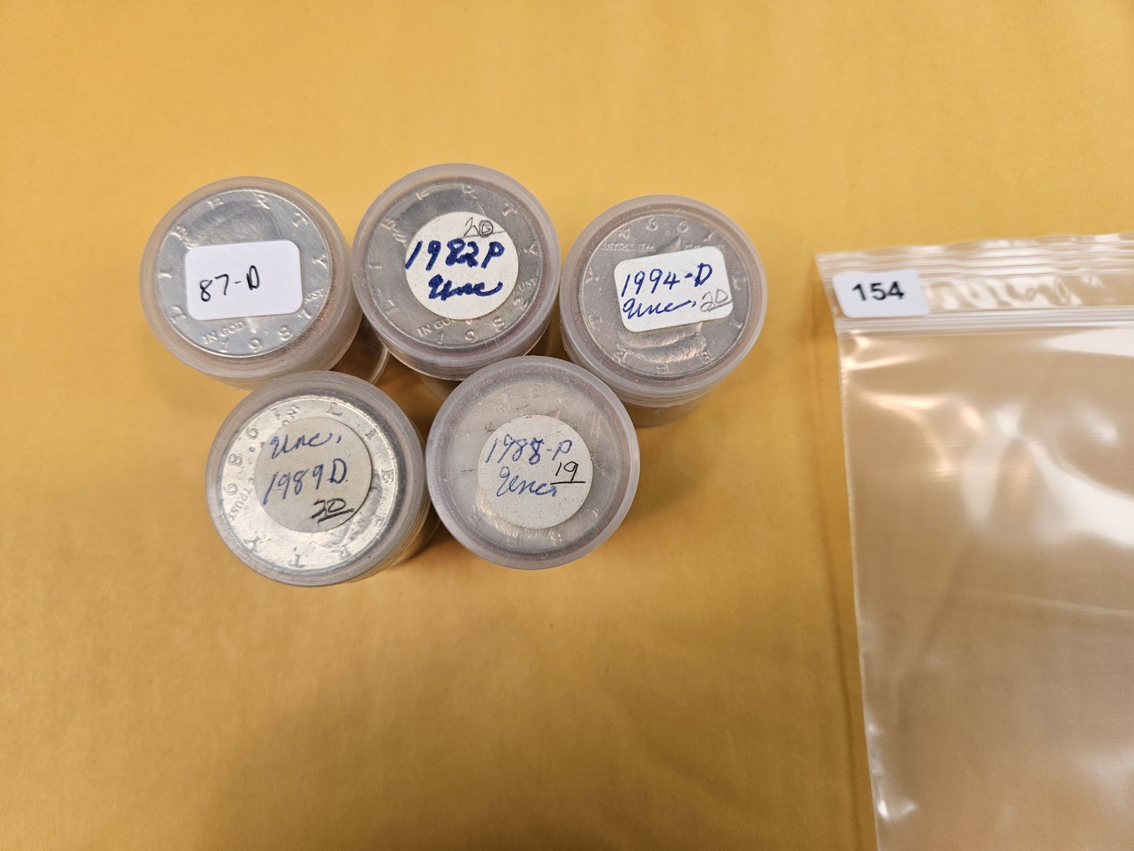 Five, mixed, Brilliant Uncirculated Kennedy half Dollar Rolls: From an old collection. We didn't open or search