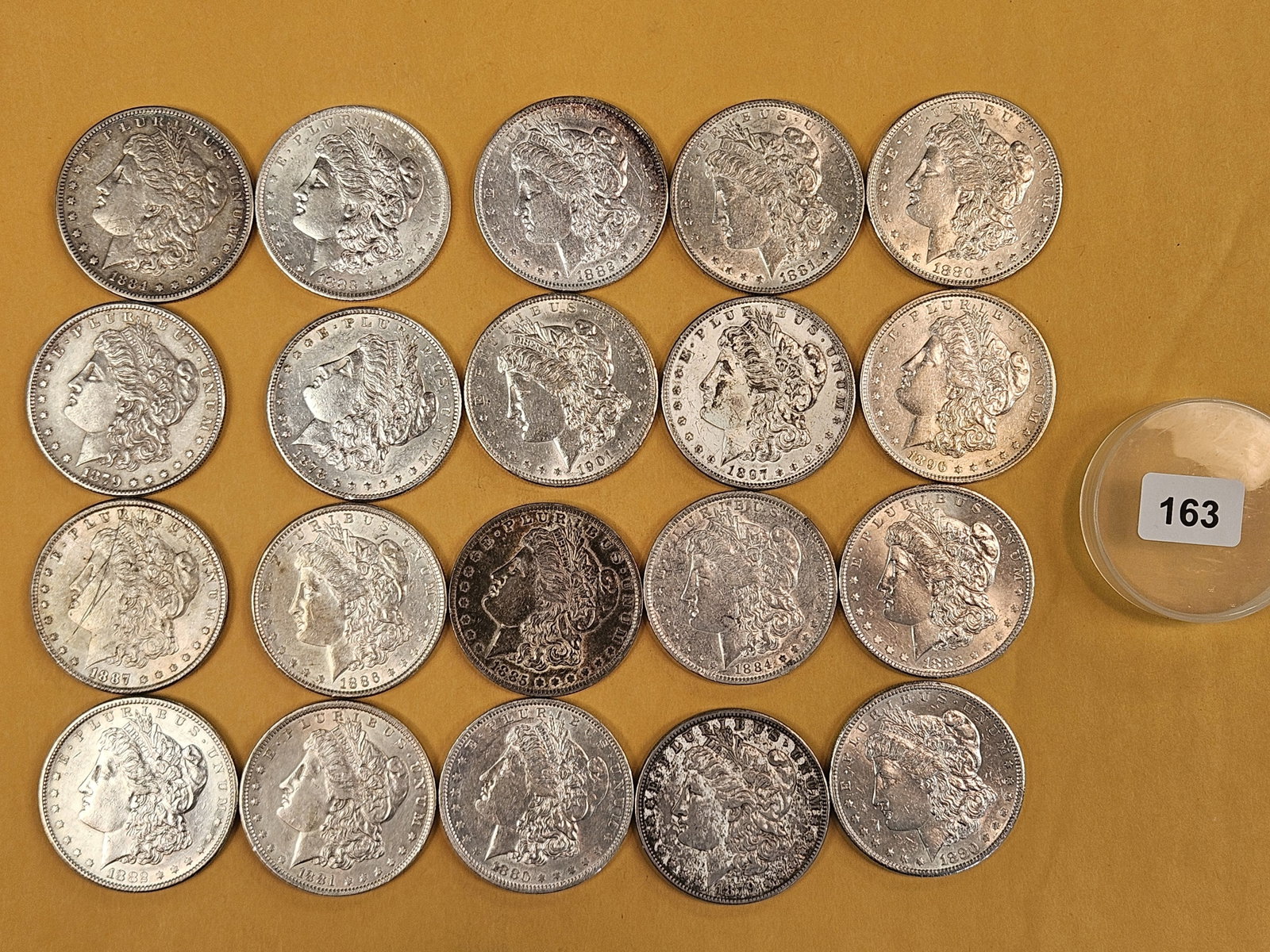 ** FULL ROLL ** Twenty Morgan Silver Dollars: All pre-1904. Grades from Very Fine through Brilliant Uncirculated plus - details