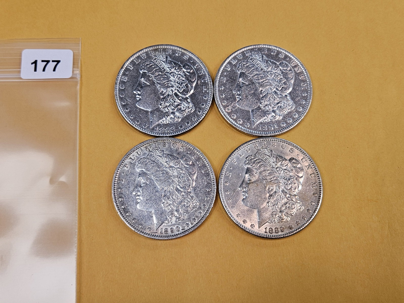 Four mixed About Uncirculated Morgan Silver Dollars - 2