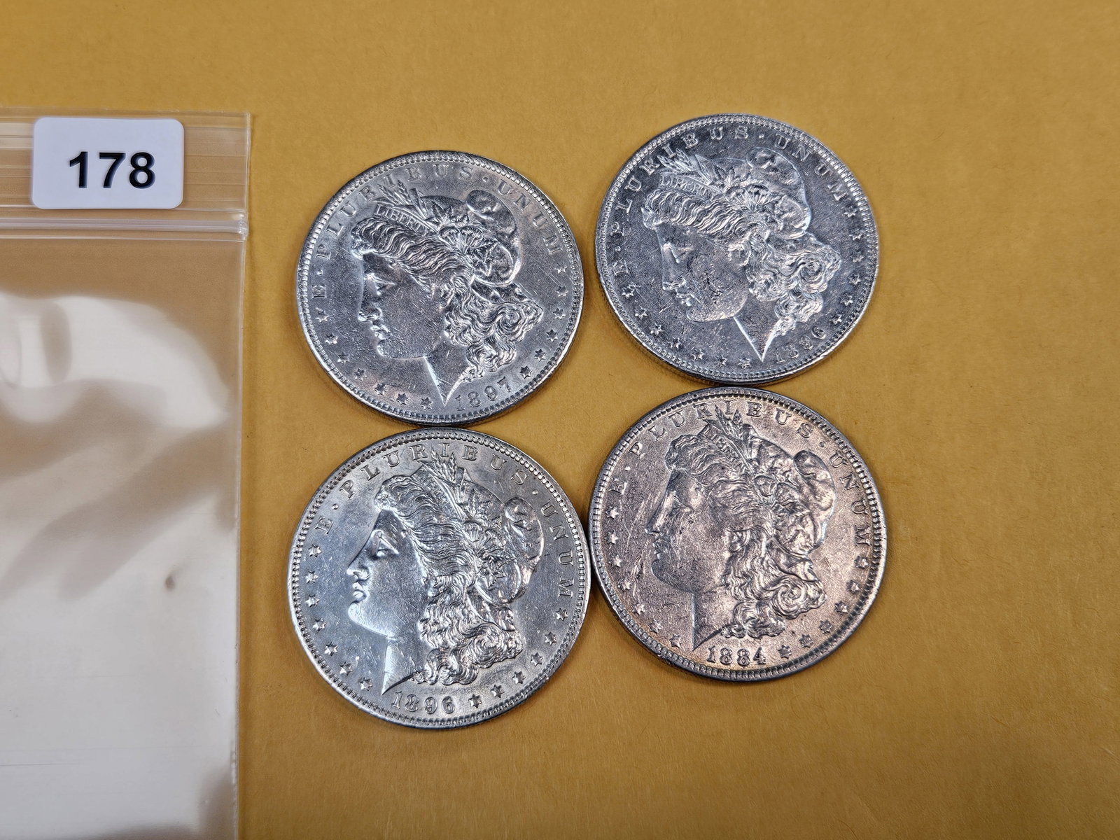 Four mixed About Uncirculated Morgan Silver Dollars - 2