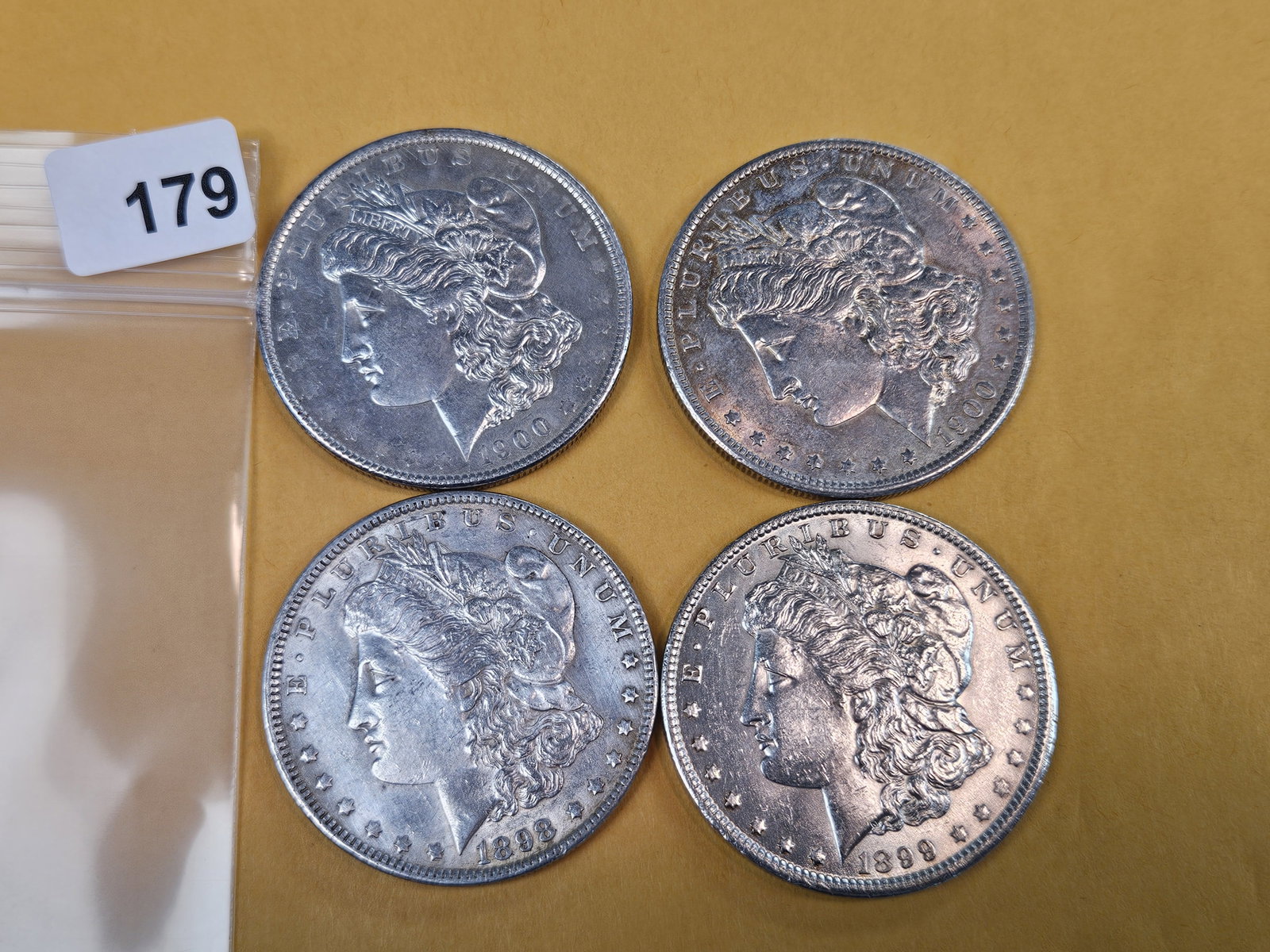 Four mixed About Uncirculated Morgan Silver Dollars - 2