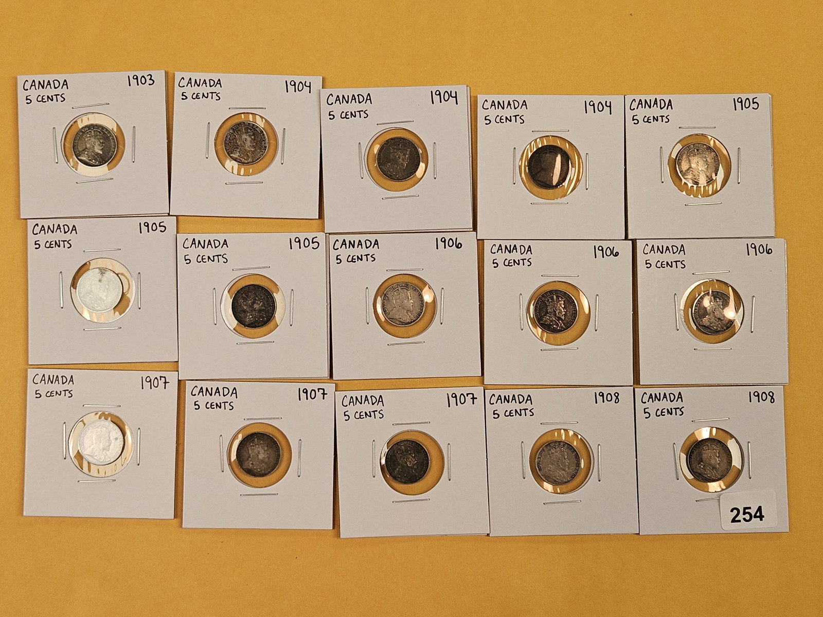 Fifteen mixed silver Canadian coins: All 5 cent coins
