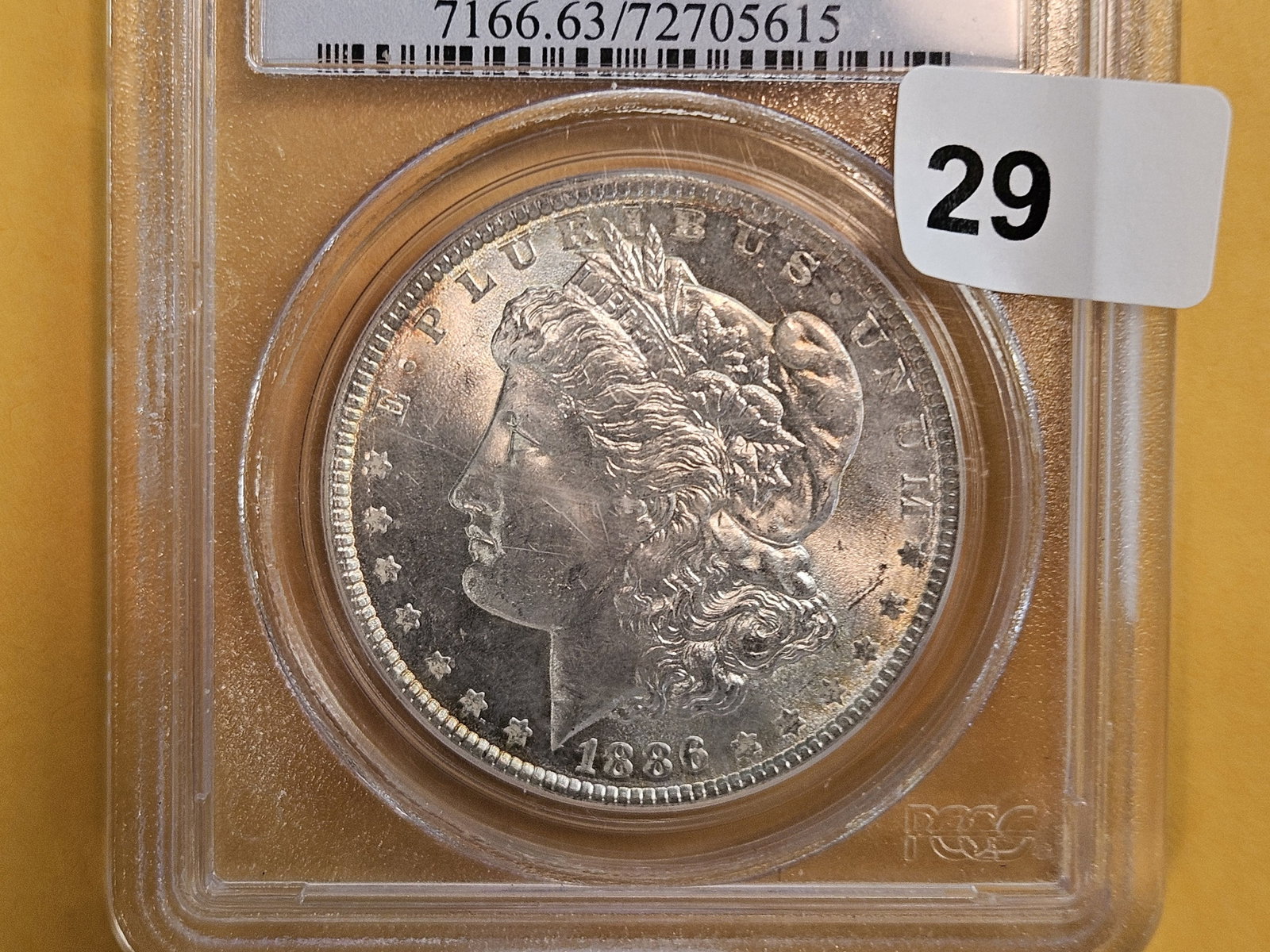 PCGS 1886 Morgan Dollar in Mint State 63: Lightly toned