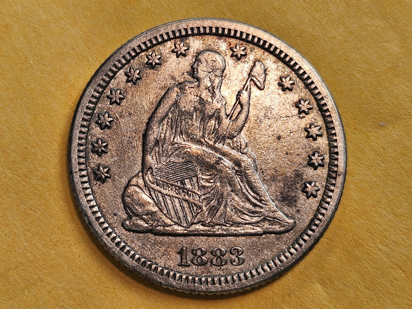 * 1883 Seated Liberty Silver Quarter in Extra Fine plus: Still has a hint of original luster