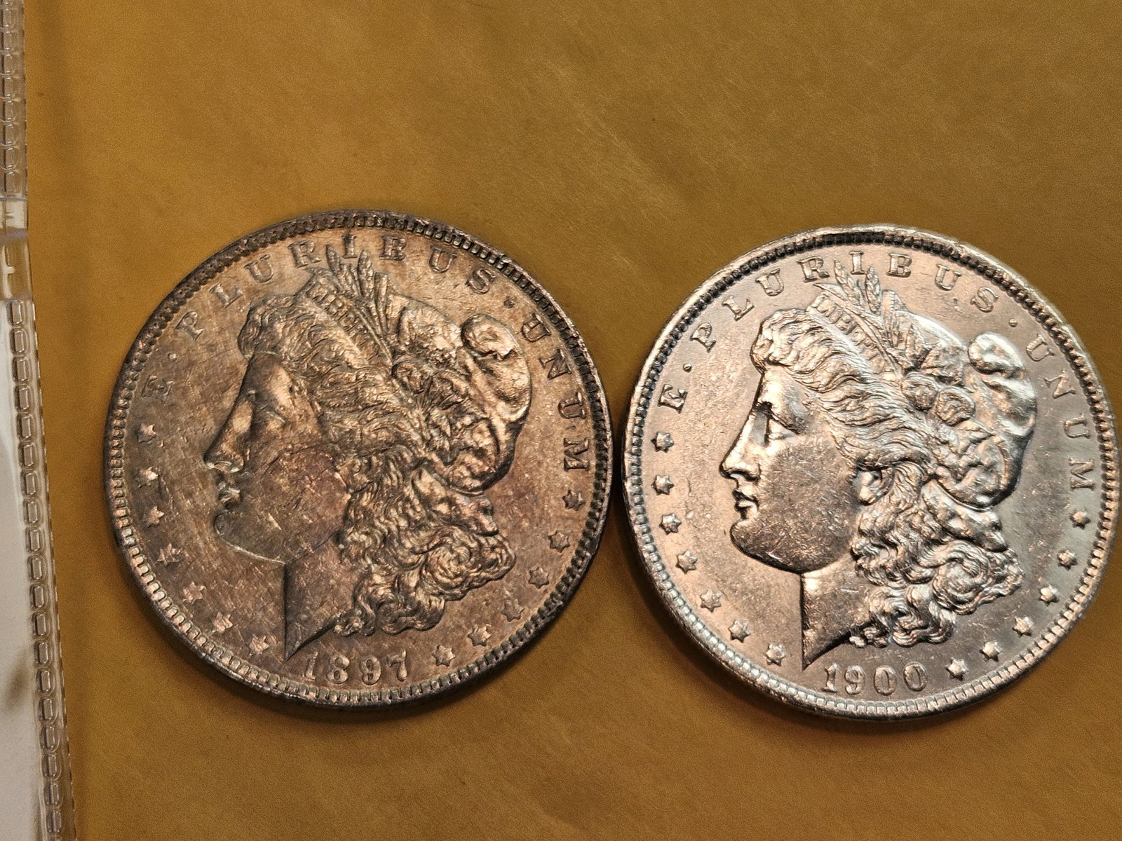 Two About Uncirculated Morgan Silver Dollars: Mixed