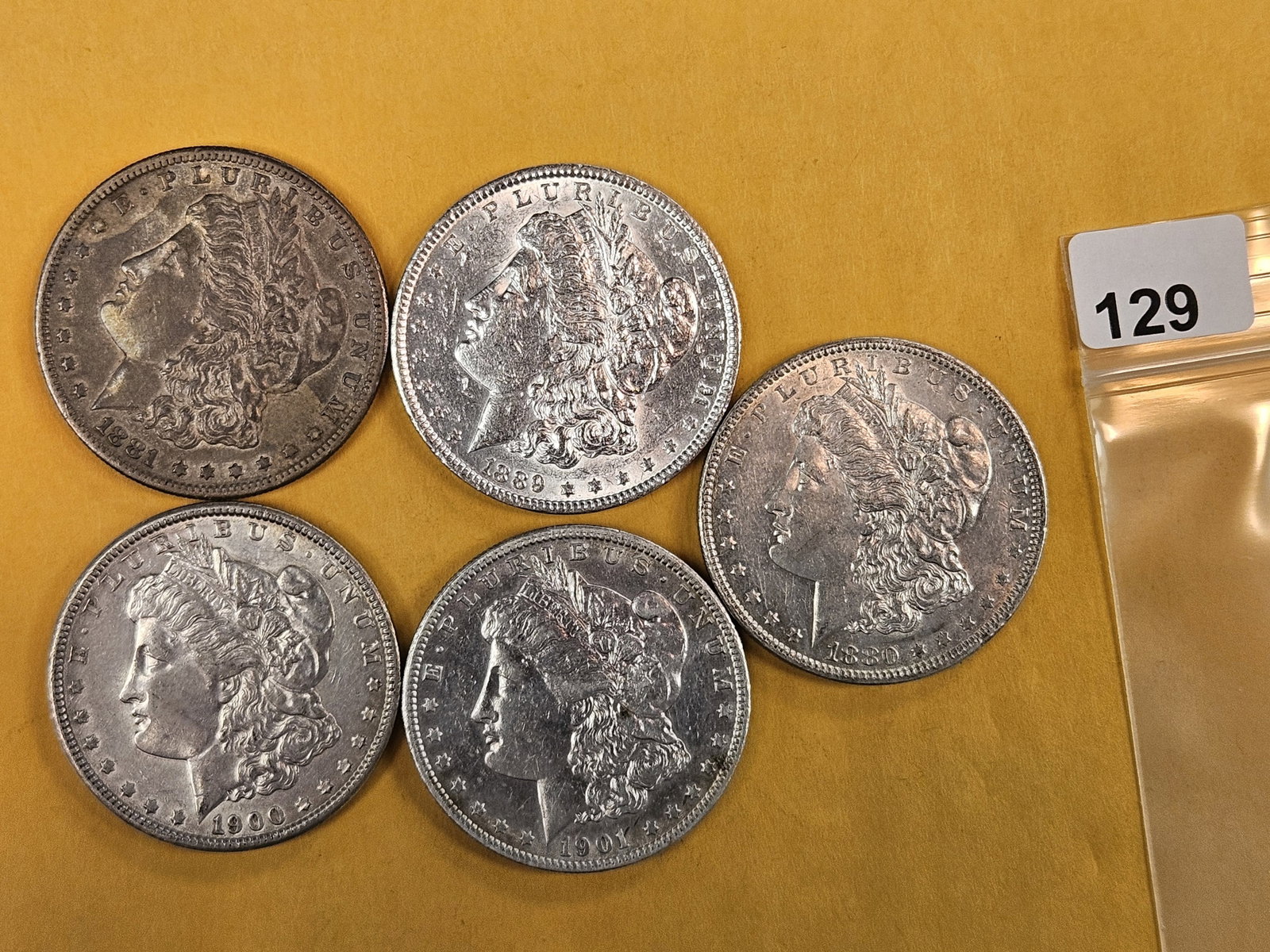 Five Morgan Silver Dollars (1 of 3)