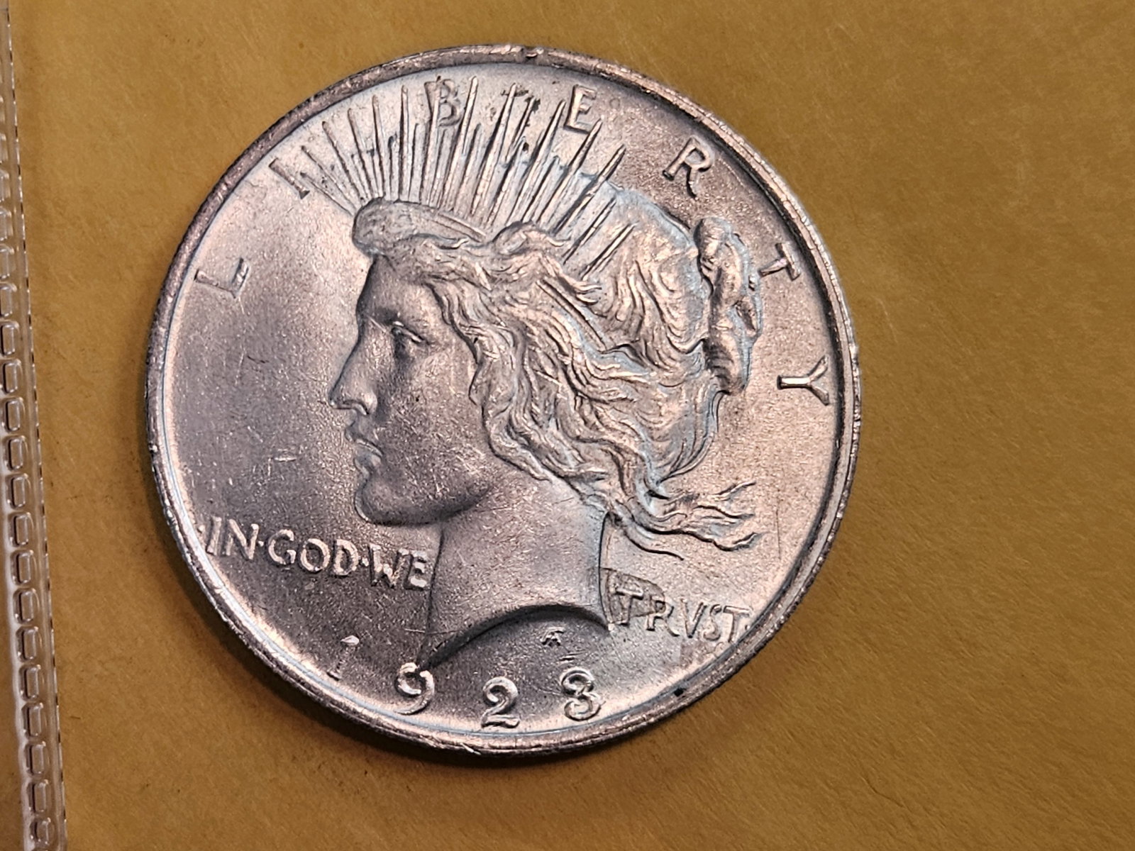 Brilliant Uncirculated Plus 1923 Peace silver Dollar: satiny luster