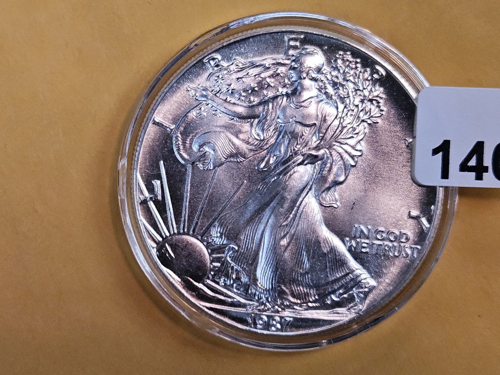 GEM Brilliant Uncirculated 1987 American Silver Eagle: In original plastic capsule